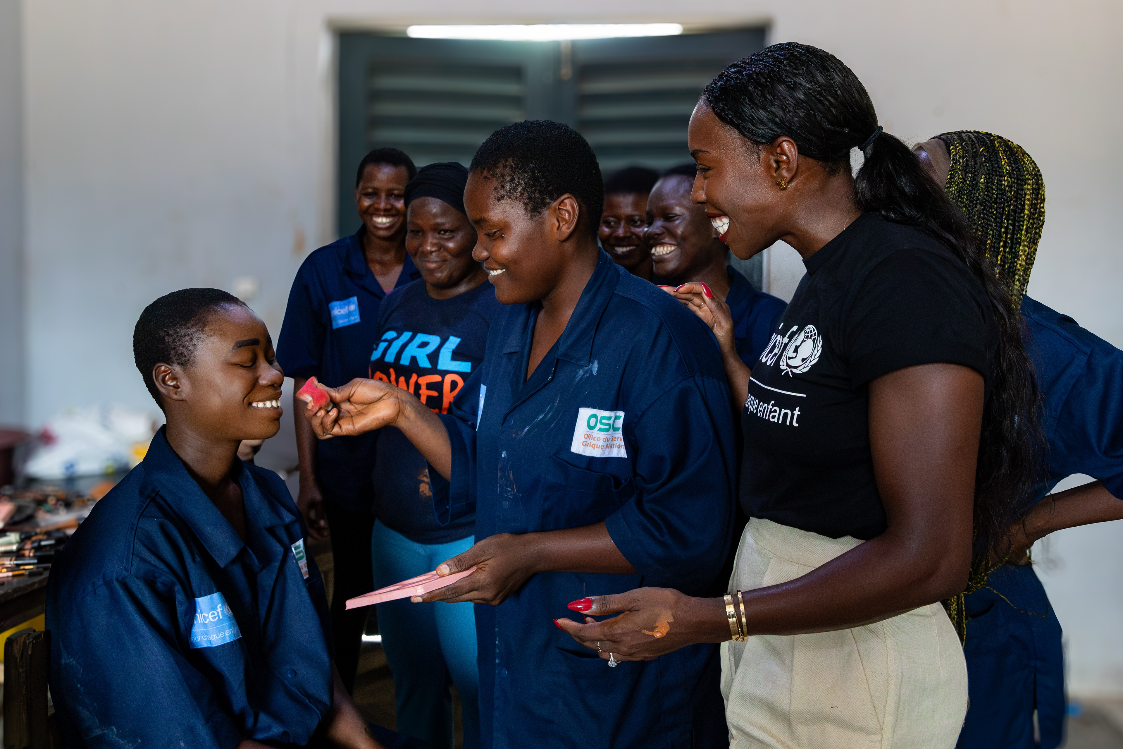 On 15th October 2024, at the Centre Civique d’Action pour le Développement in Guédikpo, South-West Côte d’Ivoire, UNICEF Ambassador Murielle Ahouré Demps participates in a makeup class as part of the Girl Power project. Captured by Miléquêm Diarassouba, Photojournalist West Africa.