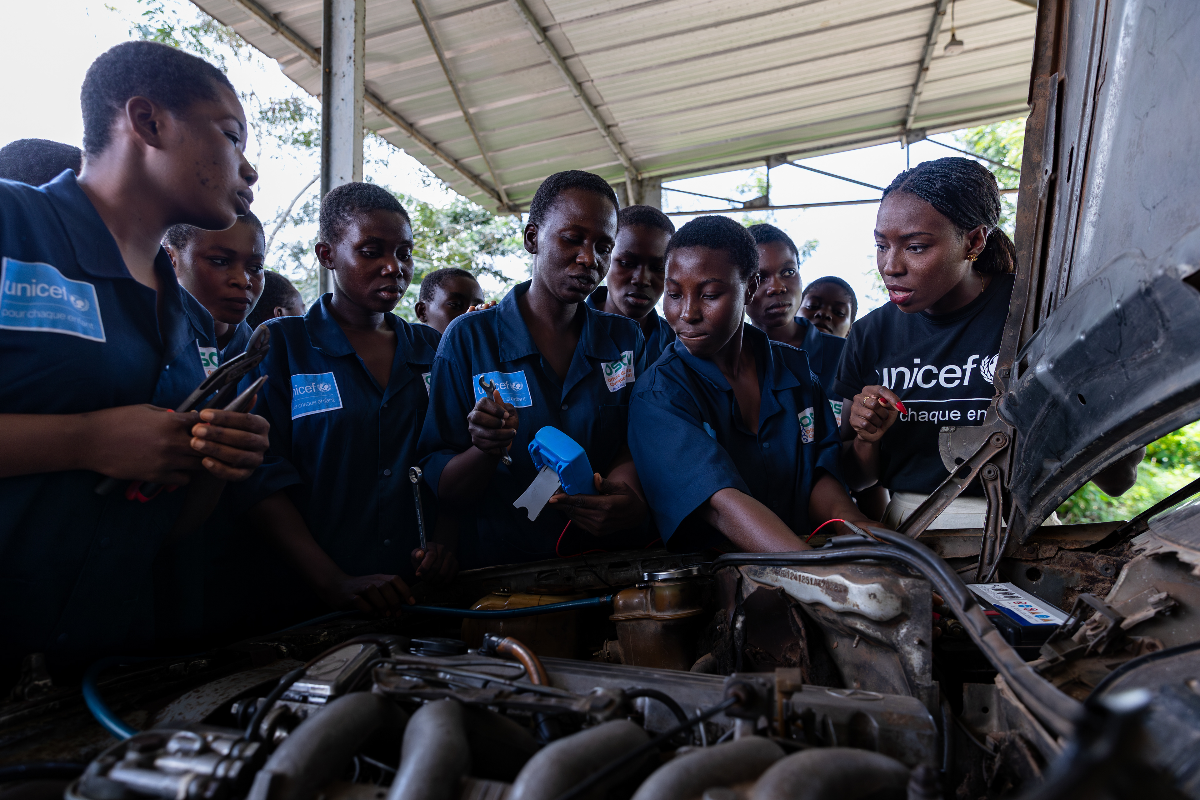 On 15th October 2024, at the Centre Civique d’Action pour le Développement in Guédikpo, South-West Côte d’Ivoire, UNICEF Ambassador Murielle Ahouré Demps meets with the girls from the automotive mechanics class during her visit. Captured by Miléquêm Diarassouba, Photojournalist West Africa.