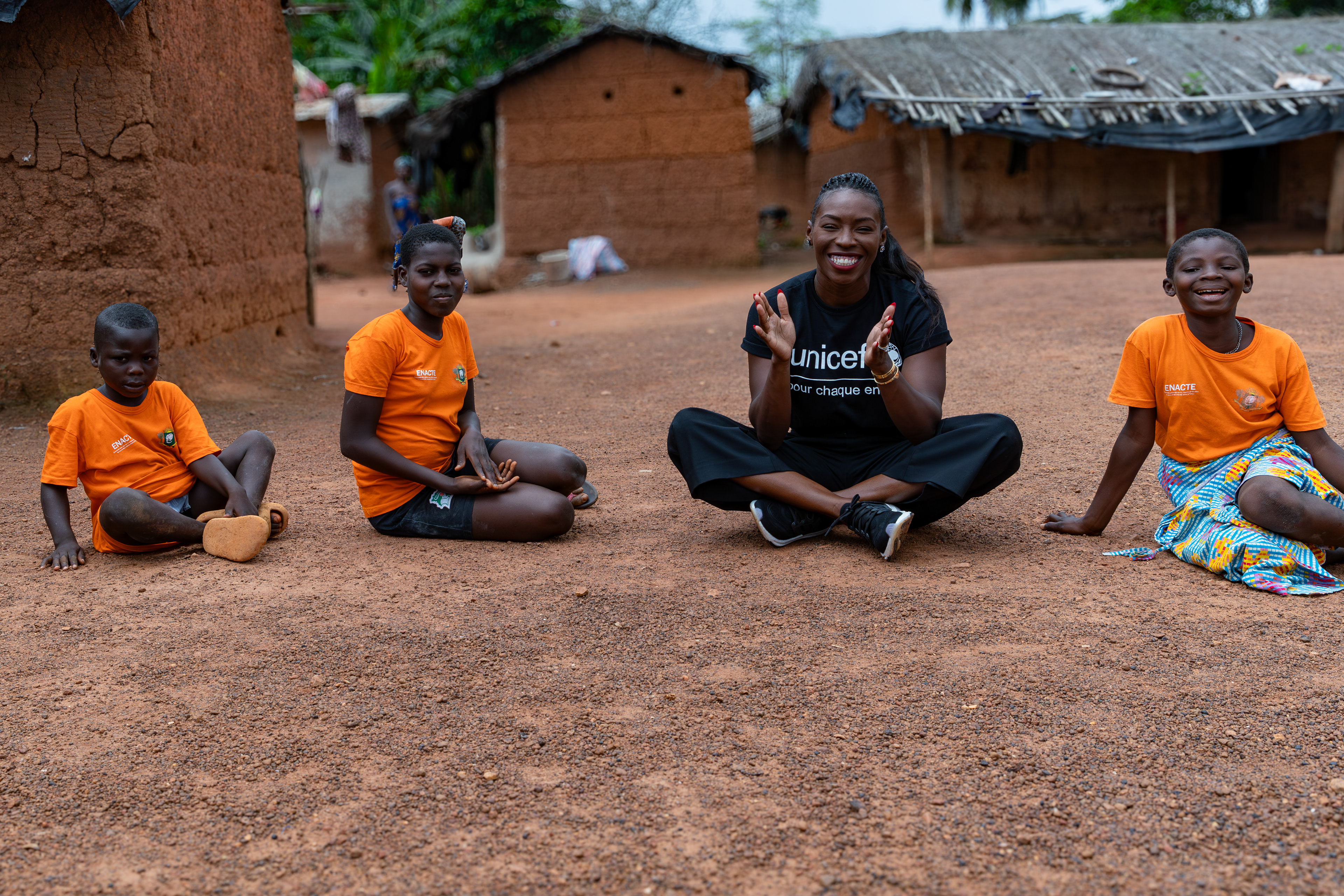 On 16th October 2024, during her visit to Rémikro, near Méagui, South-West Côte d’Ivoire, UNICEF Ambassador Murielle Ahouré Demps plays with the children from the itinerant teaching class during recess. Captured by Miléquêm Diarassouba, Photojournalist West Africa.