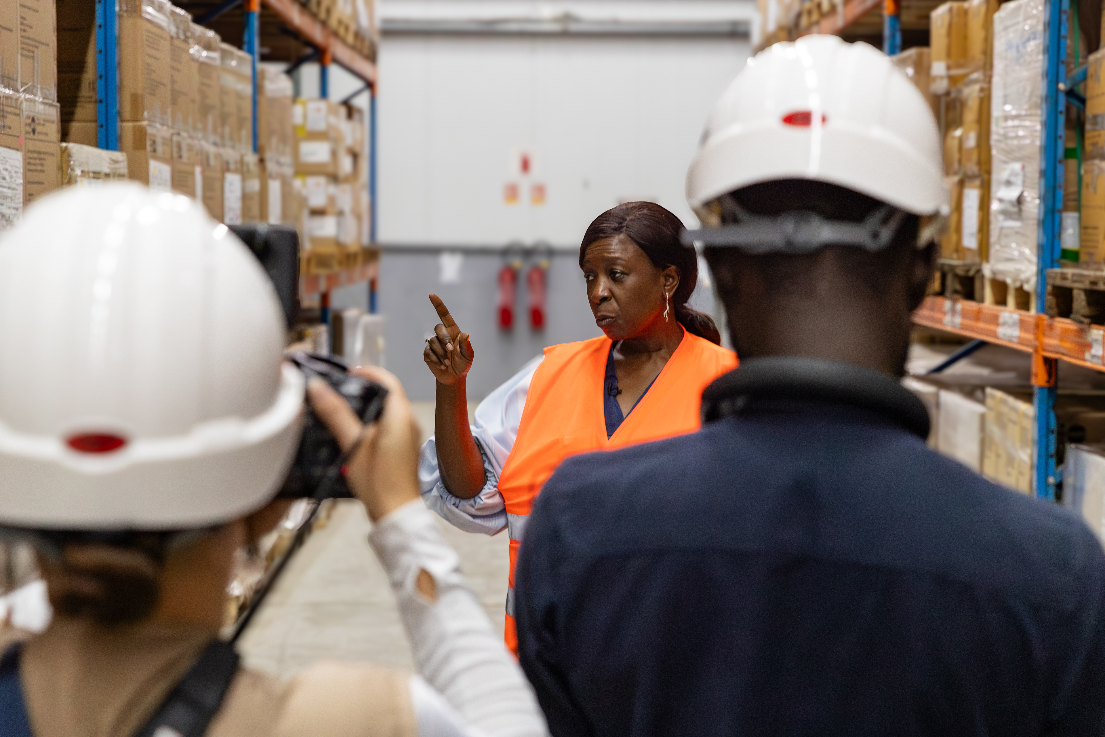 UNFPA Executive Director Dr. Diene Keita visiting the NPSP warehouse in Abidjan on 9 September 2025, accompanied by officials and wearing protective vests and helmets. The visit highlighted the country’s pharmaceutical supply and distribution system. Image by Miléquêm Diarassouba, photojournalist West Africa.