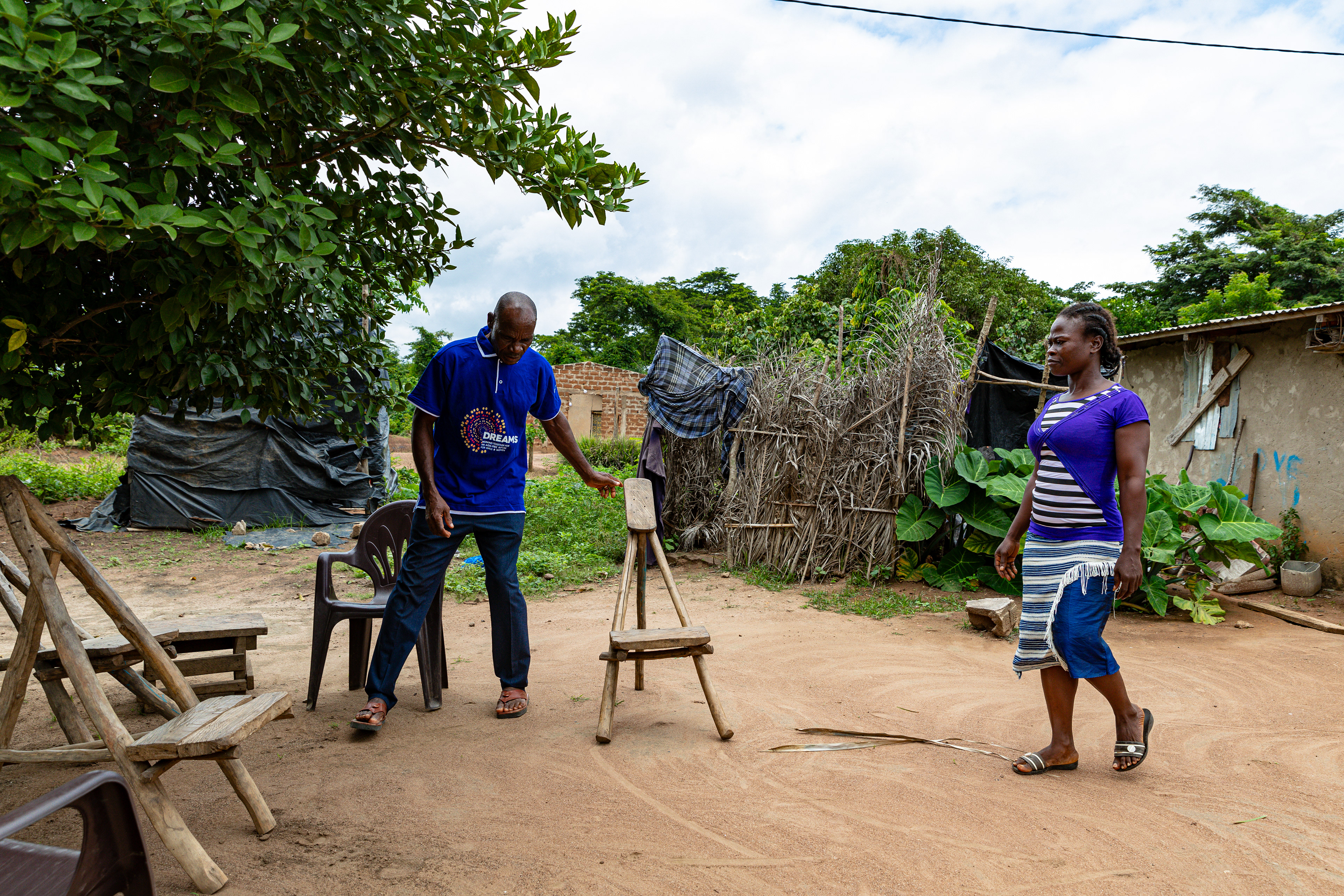 Digbeu Zeze Sylvain, a DREAMS Godfather, came to talk to a woman who called on him to resolve a conflict in the village of Zokoguhé, 18 km from Daloa in western Côte d'Ivoire, on 29 June 2024.
