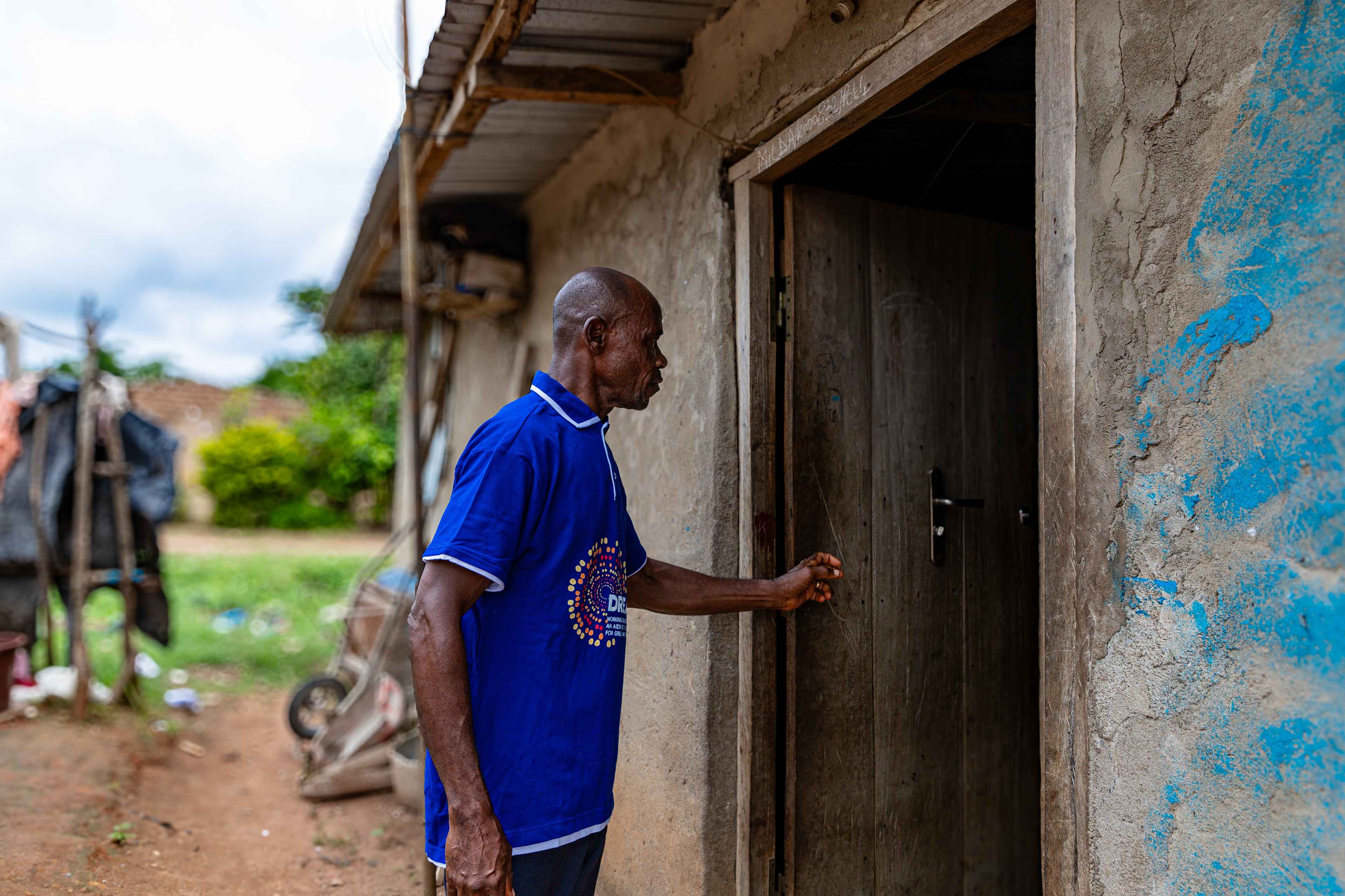 Digbeu Zeze Sylvain, a DREAMS Godfather, came to talk to a woman who called on him to resolve a conflict in the village of Zokoguhé, 18 km from Daloa in western Côte d'Ivoire, on 29 June 2024.
