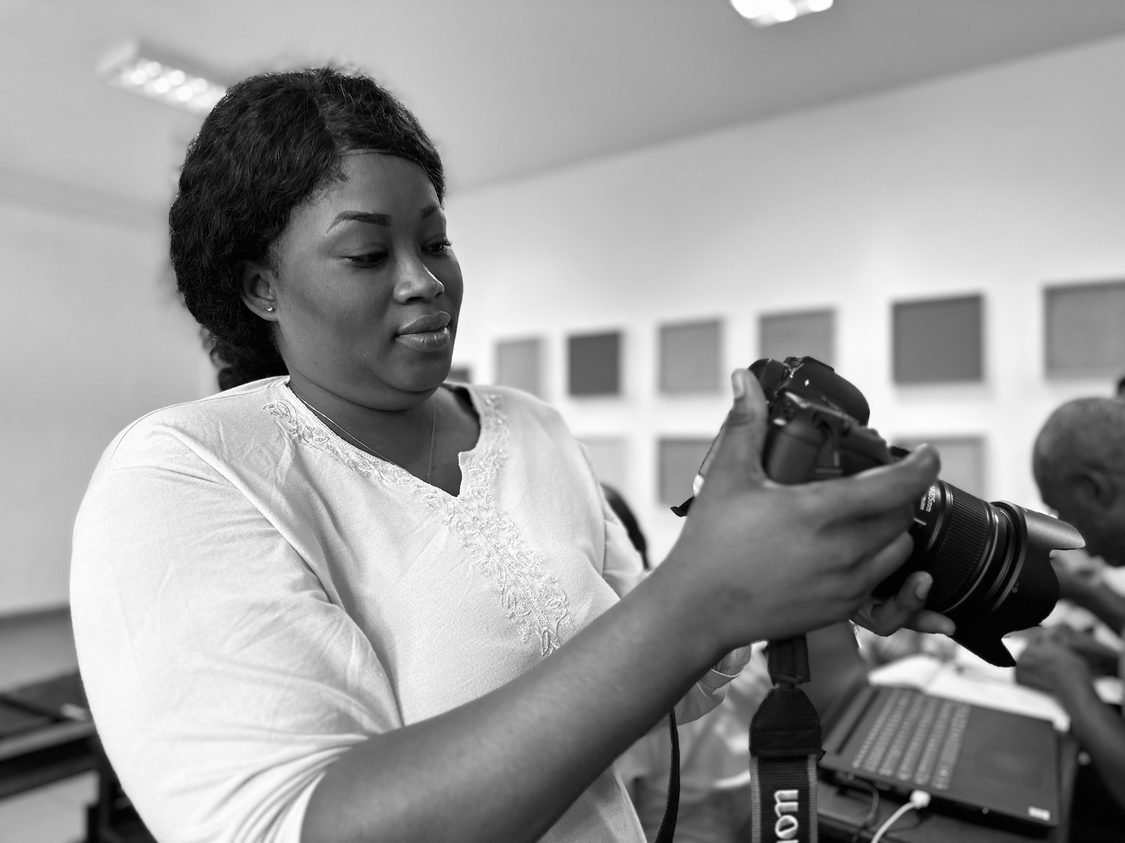 Miléquêm Diarassouba, Photojournalist West Africa, guiding a woman in photography training at Université Nangui ABROGOUA, Abidjan, Côte d'Ivoire, 30 January 2024.