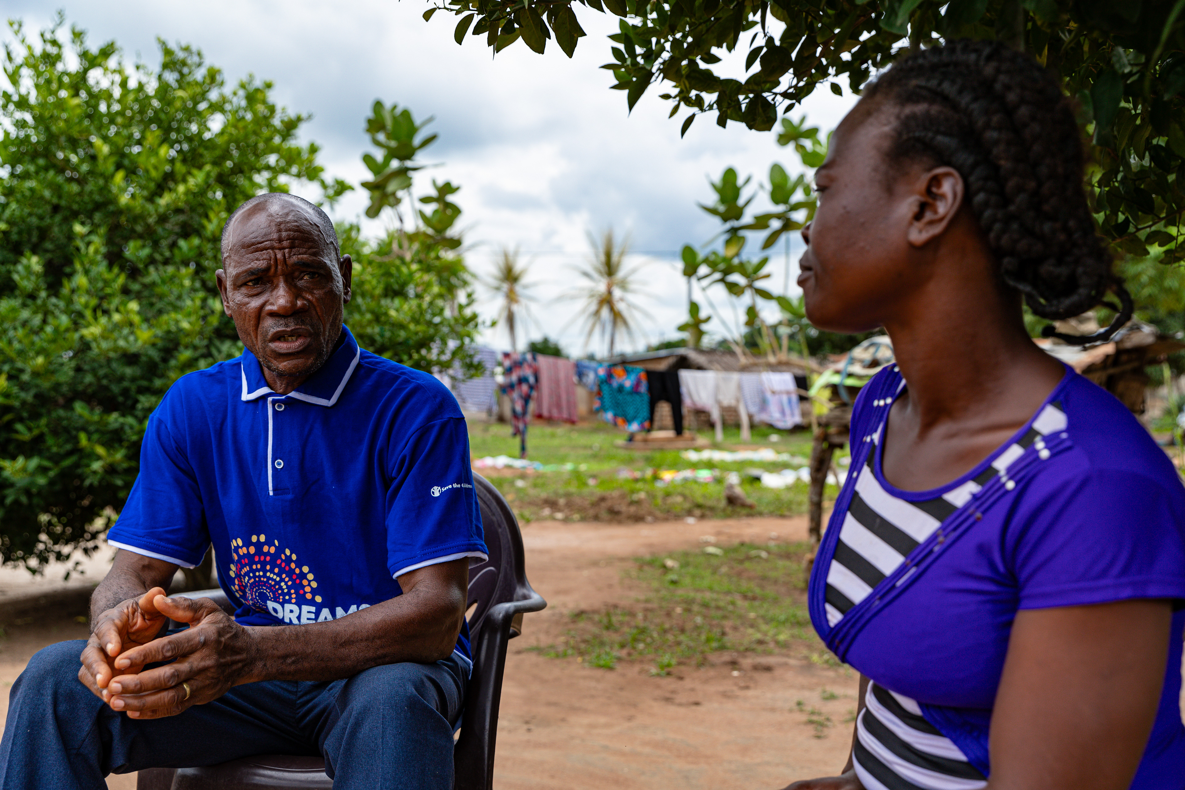 Digbeu Zeze Sylvain, a DREAMS Godfather, came to talk to a woman who called on him to resolve a conflict in the village of Zokoguhé, 18 km from Daloa in western Côte d'Ivoire, on 29 June 2024.