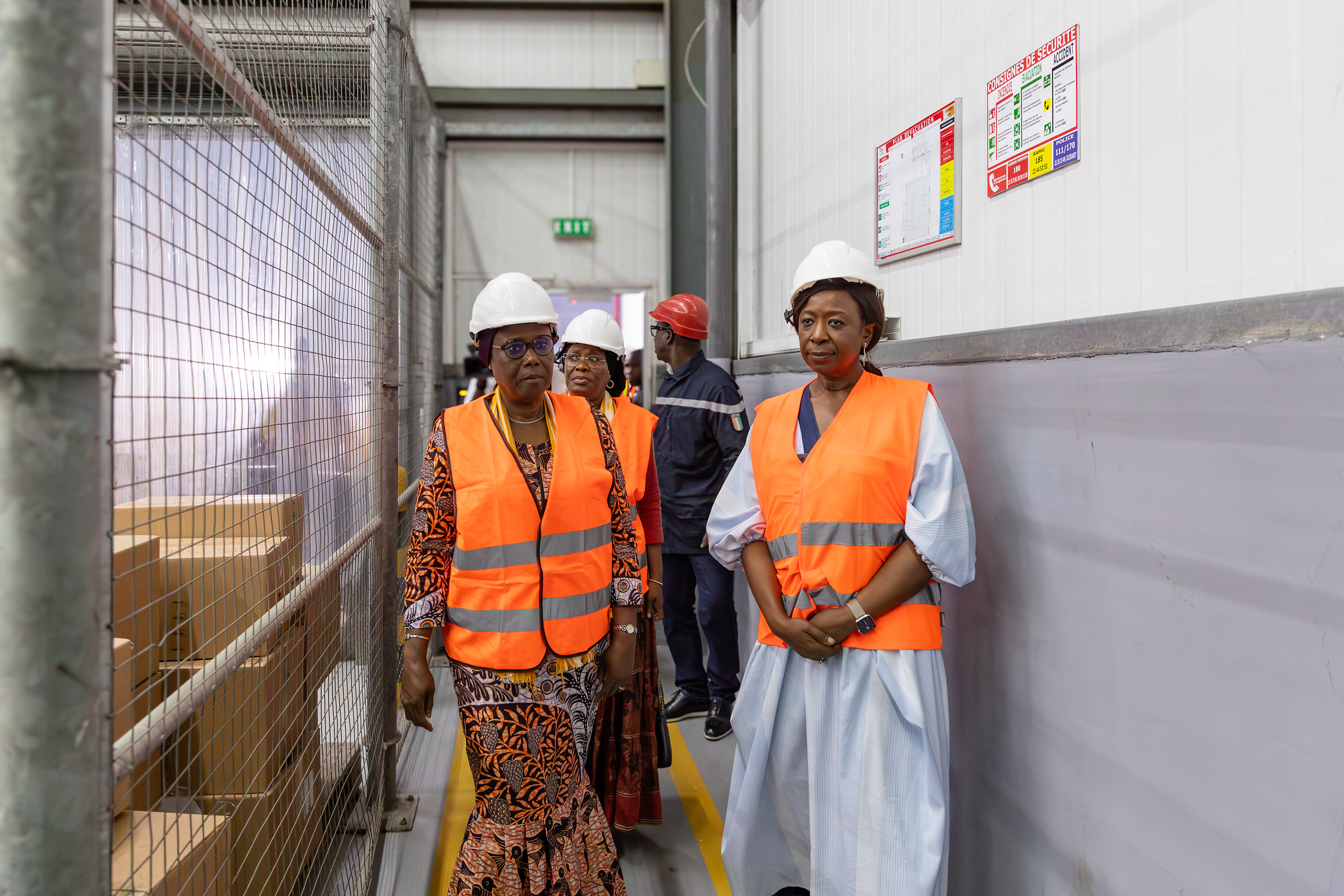 UNFPA Executive Director Dr. Diene Keita visiting the NPSP warehouse in Abidjan on 9 September 2025, accompanied by officials and wearing protective vests and helmets. The visit highlighted the country’s pharmaceutical supply and distribution system. Image by Miléquêm Diarassouba, photojournalist West Africa.