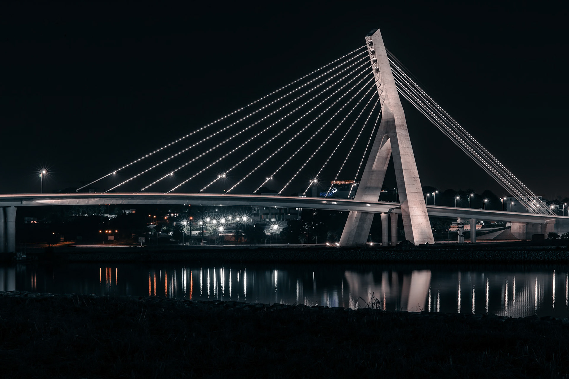 The Alassane Ouattara bridge, in Le Plateau, Abidjan, in the south of Côte d'Ivoire. The Alassane Ouattara Bridge is a cable-stayed road bridge in Abidjan, Côte d'Ivoire. It links the communes of Cocody and Plateau. It is the city's fifth bridge