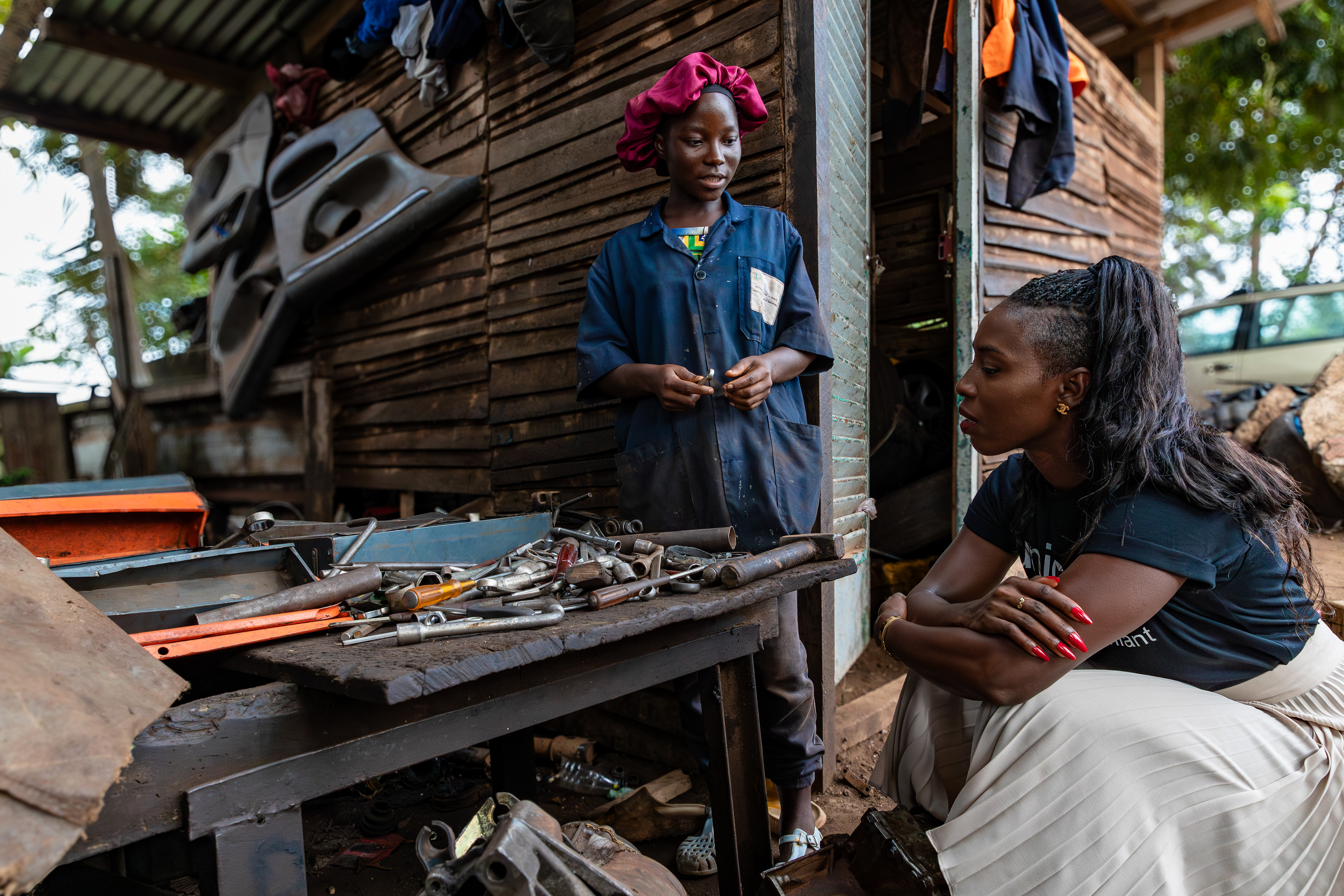 UNICEF Ambassador Murielle Ahouré Demps meets 18-year-old Marie Grace, who is training in mechanics in San Pedro, South-West Côte d’Ivoire, on 14th October 2024.