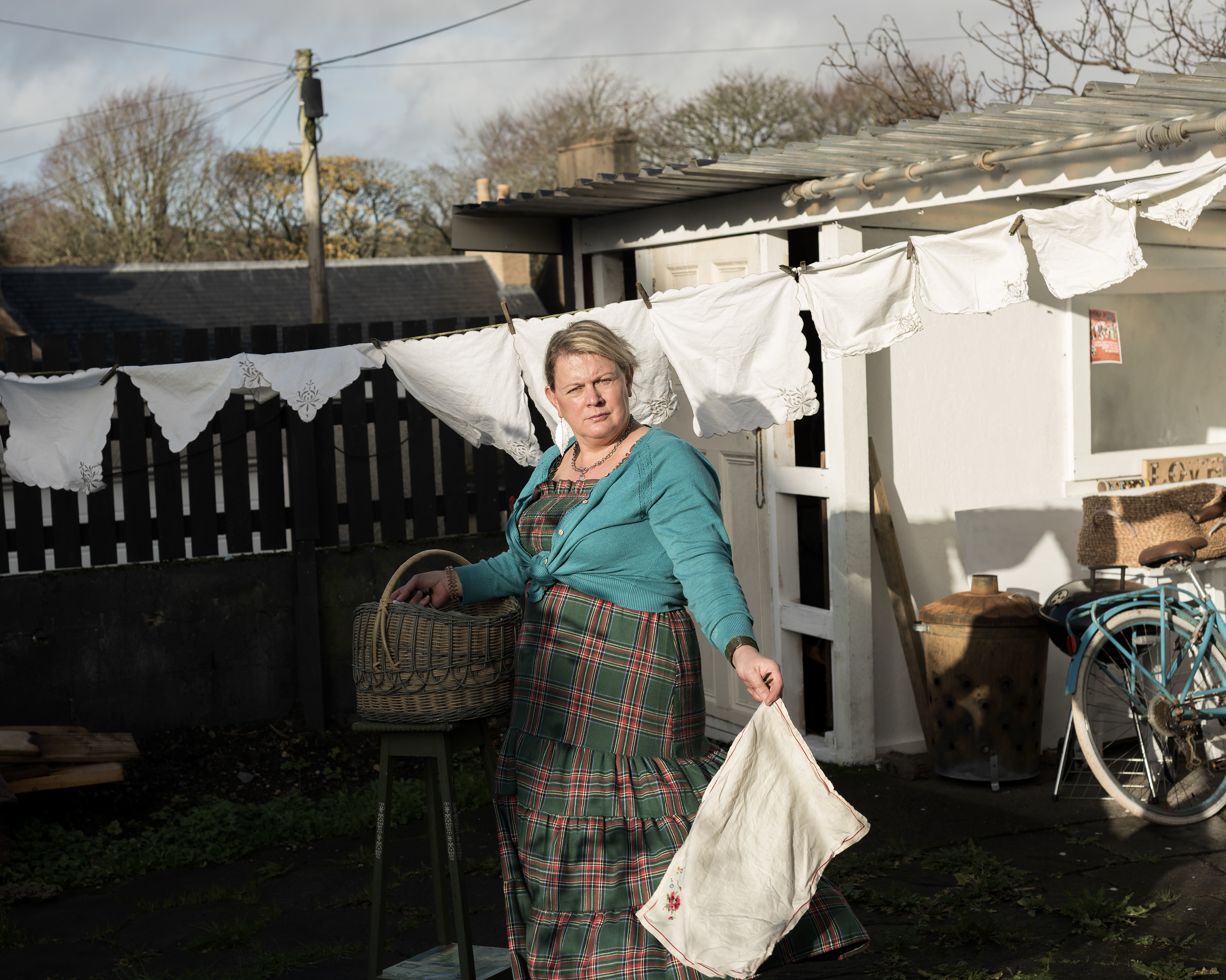 Alicia Bruce - Moira contemplates incorporating vintage hankies to create a bunting installation and starts hanging them in her Stornoway garden as bagpipes begin playing in the distance for Remembrance Sunday.