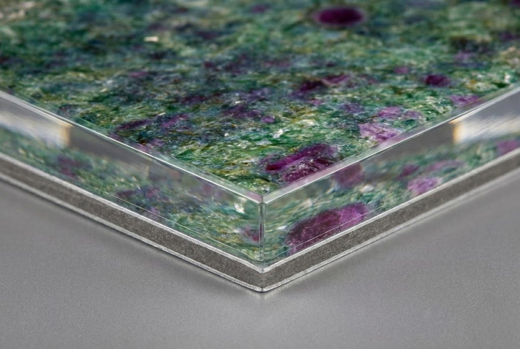 Side profile detail of a museum-quality Acrylic Face Mount print, showing the thick diamond-polished acrylic glass edge and aluminum backing.