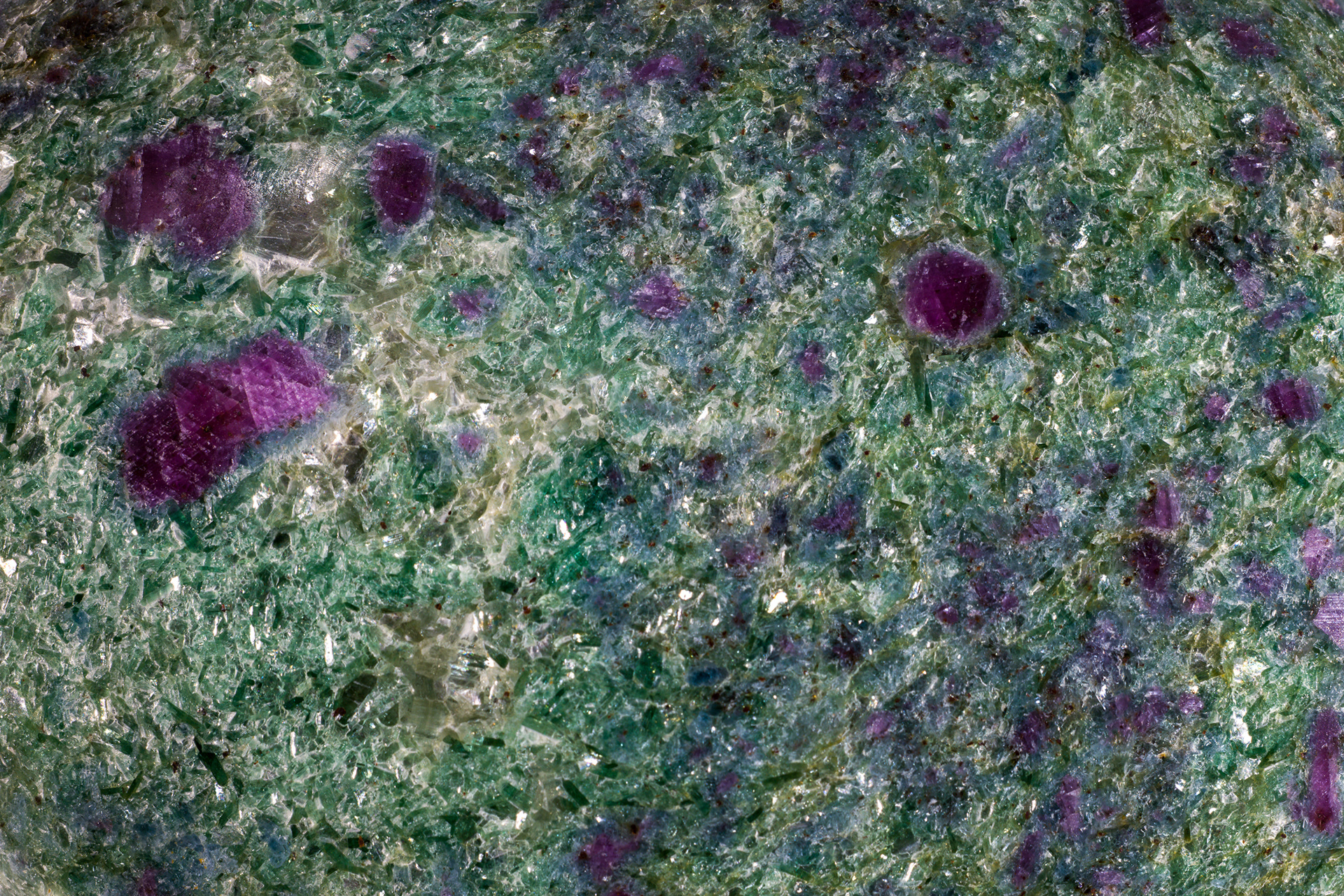 Emerald Nebula - Macro photography of Ruby in Fuchsite resembling deep space.