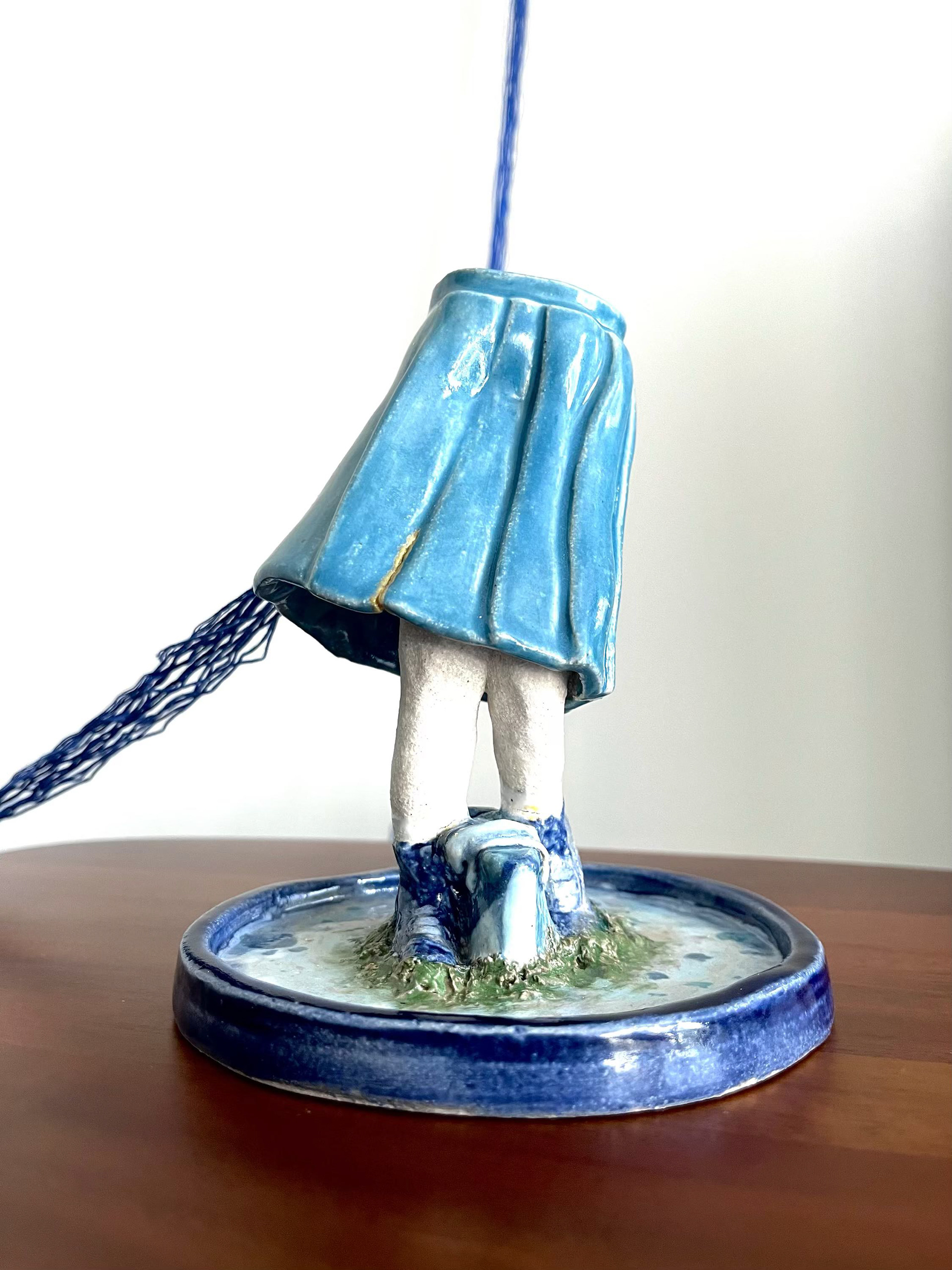 Bottom half of Manananggal, connected by threads.