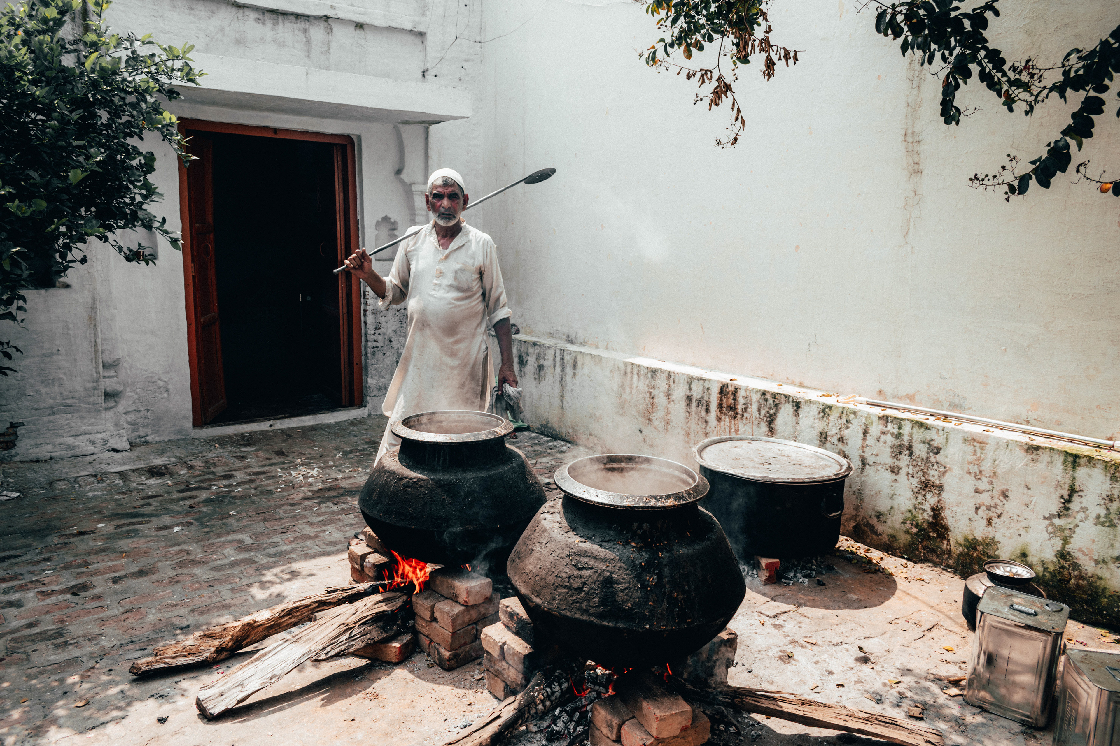 A cook with Pots of Food known as Khichda