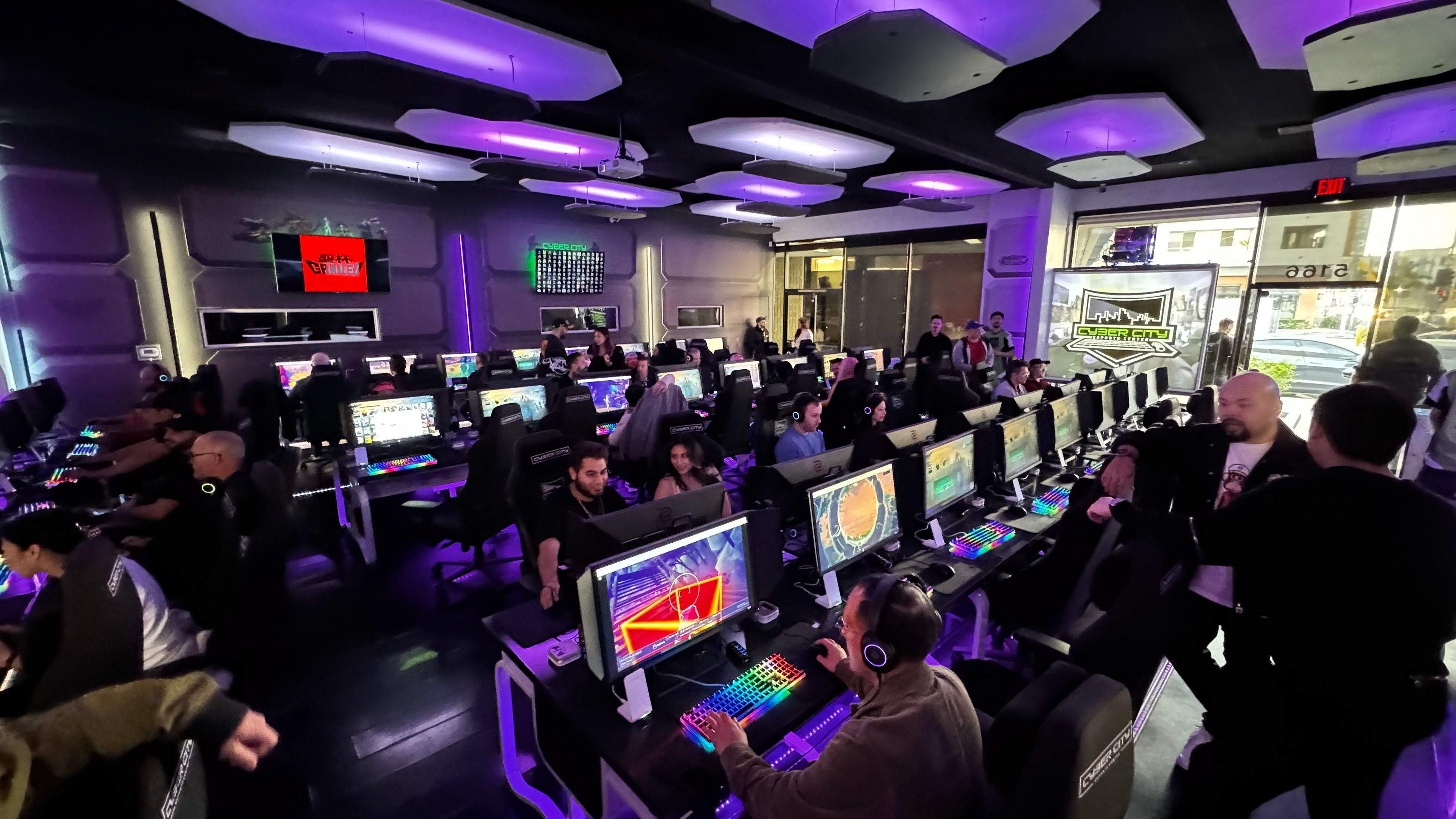 Guests at gaming PCs in the Cyber City Esports Center during the 10KTF community event
