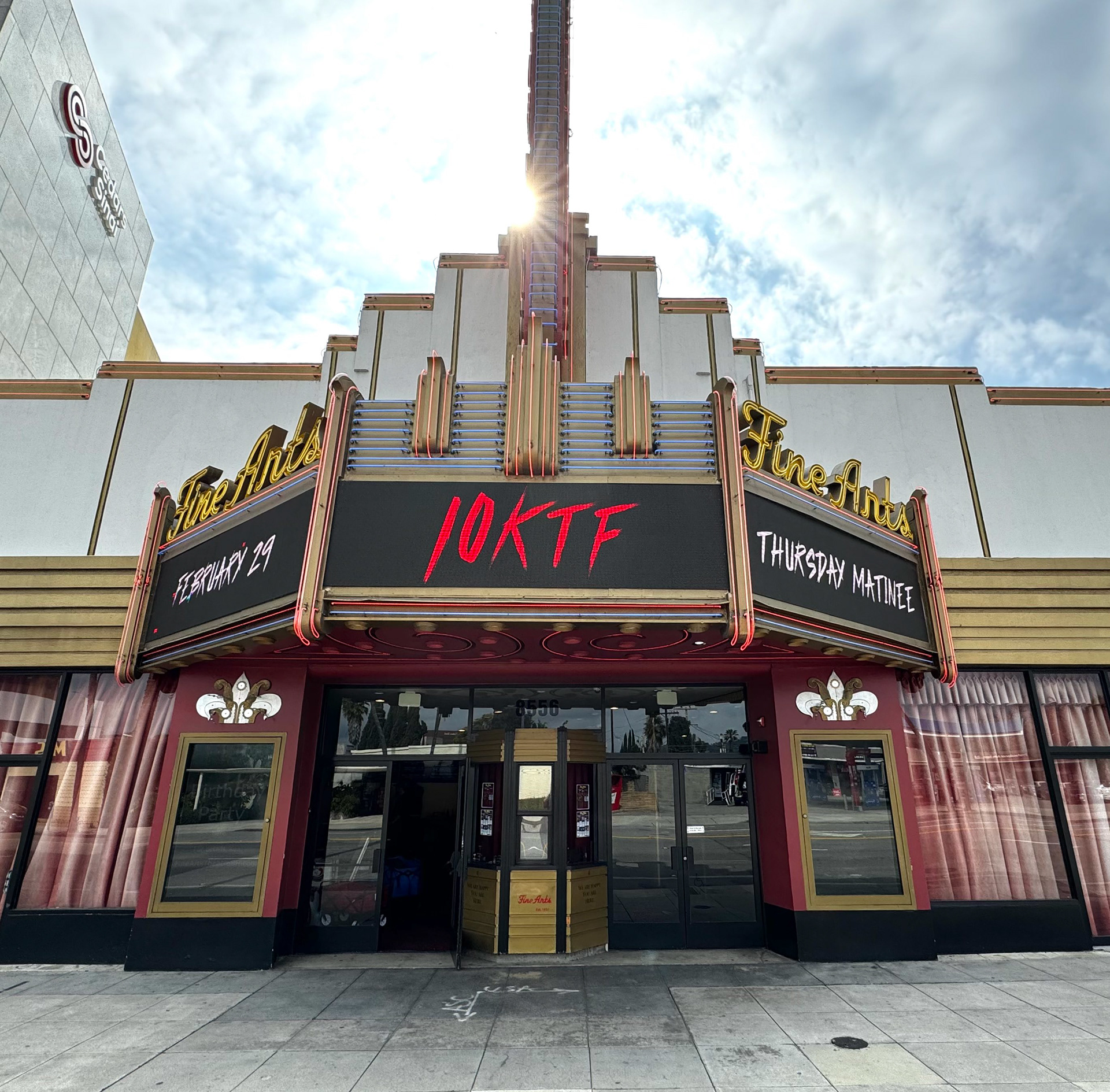 Exterior of the Fine Arts Theatre in Hollywood with a 10KTF Thursday Matinee marquee