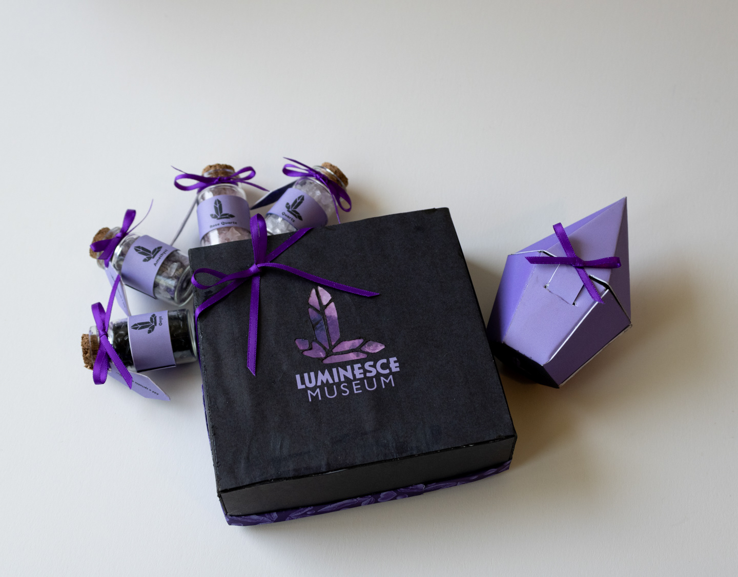 Museum gift shop products: Gift box (center), Seed crystal bottles (left), Ring box (right)