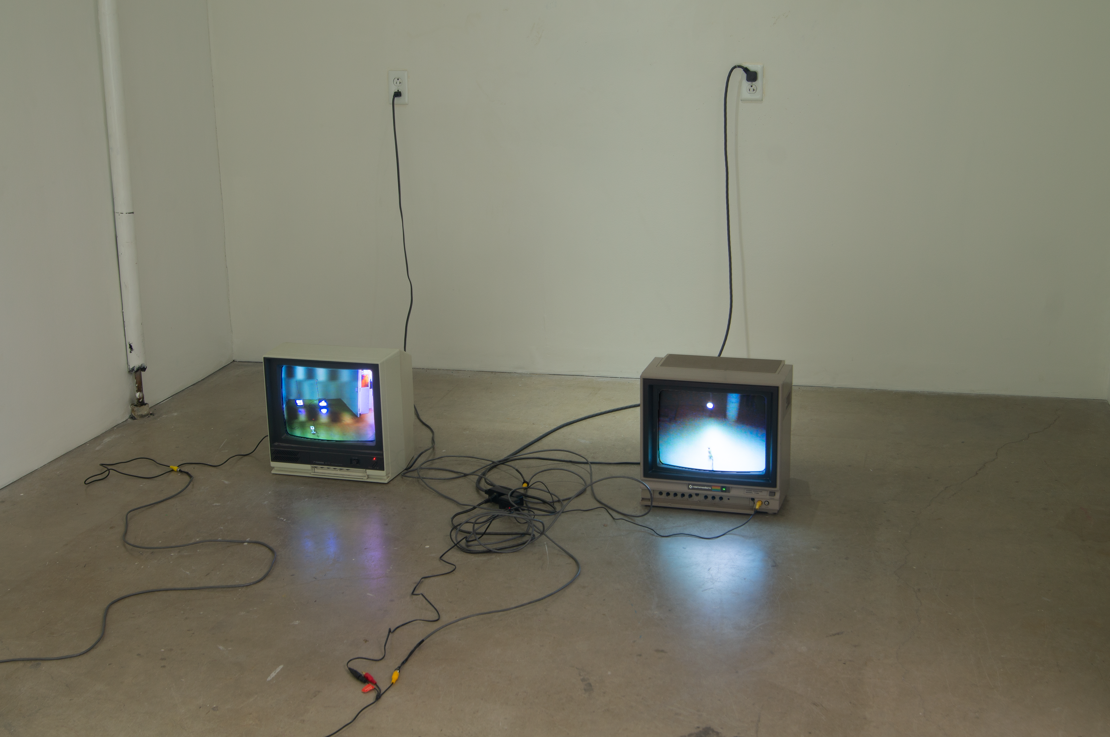 Vintage TV Monitors providing live visuals for live feed from cameras add lo-fi aesthetics to contemporary interactions with surveillance.