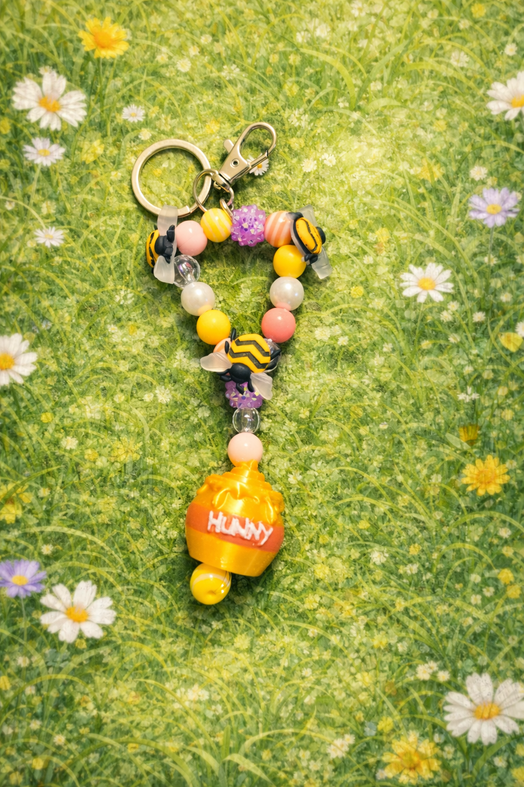 A matching Hunny Pot keychain makes the perfect companion to the keepsake pot. Adorable keychain or a diaper bag charm for a fun and sweet reminder of the celebration.