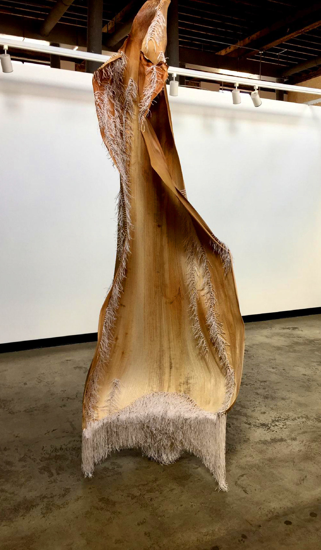 An intimate pattern of action: weaving this sable palm husk triggered a powerful identification and projection of entire body and mind. Like skin, it became forgiving, repetitive stitching became healing, reminding like step after step to keep going to clarify and make whole my self and my country.