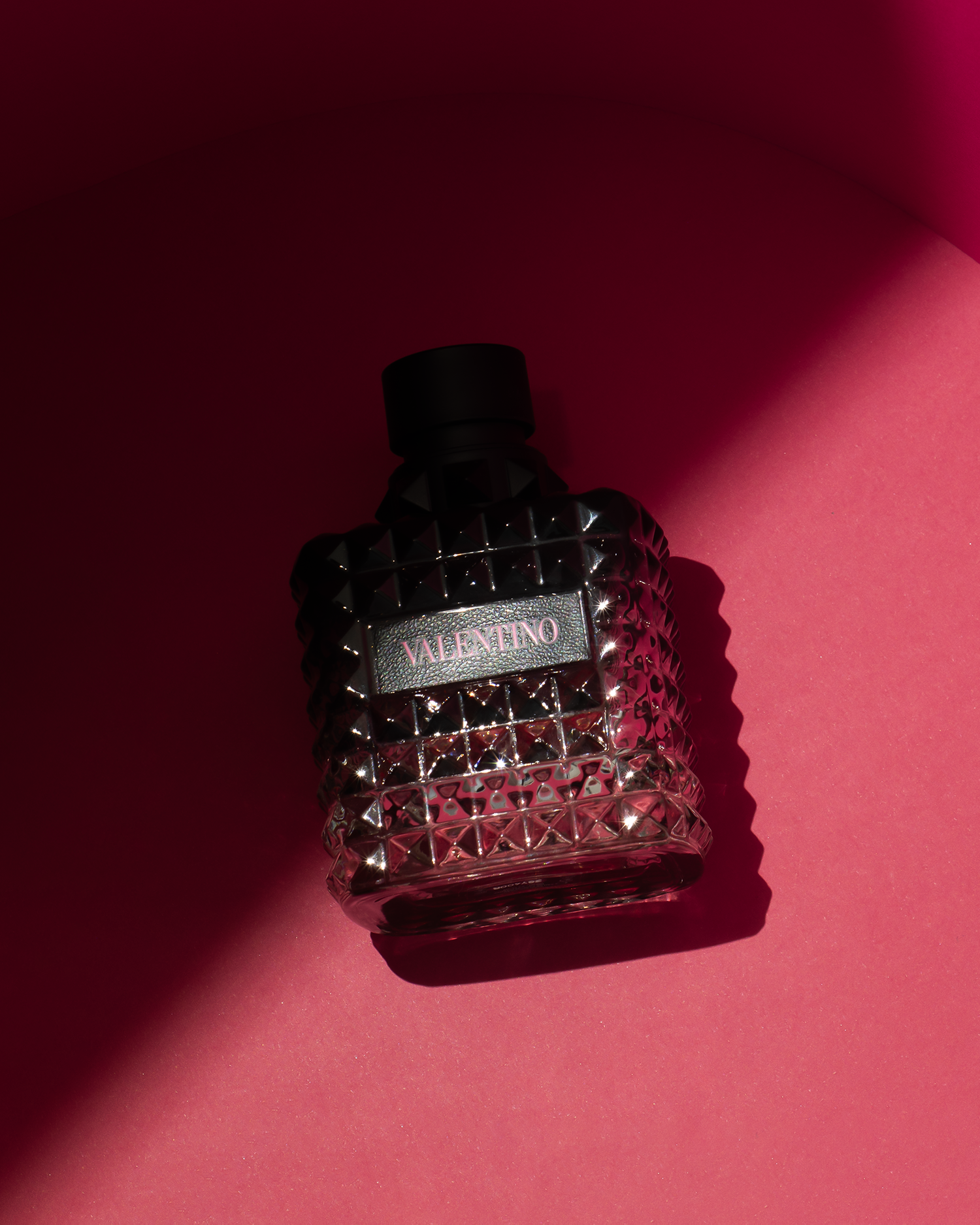 Dark luxury perfume bottle photography