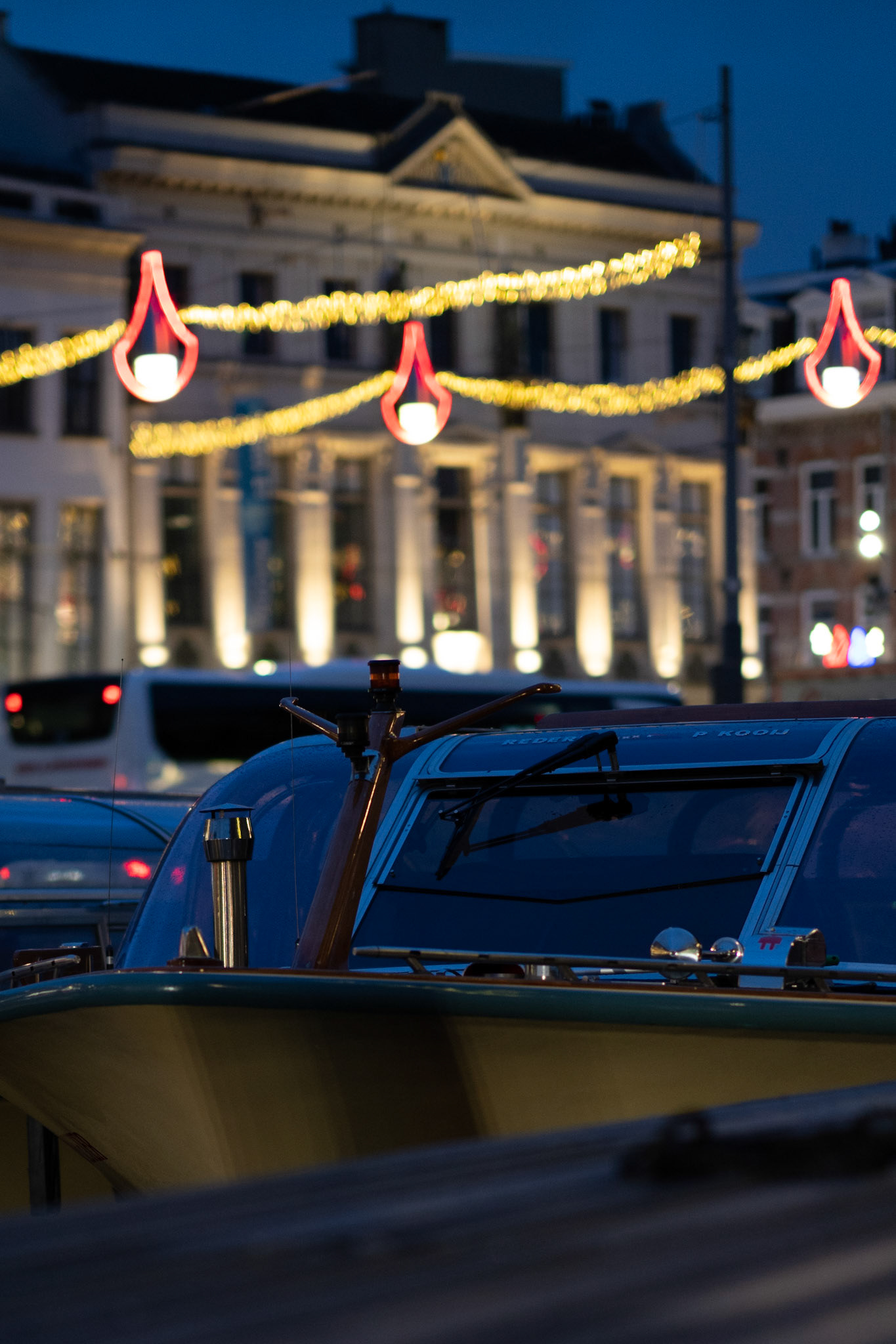 Canal boat mured at Rokin close to Dam square on a cold January morning. Quite moments before the tourists will arrive.