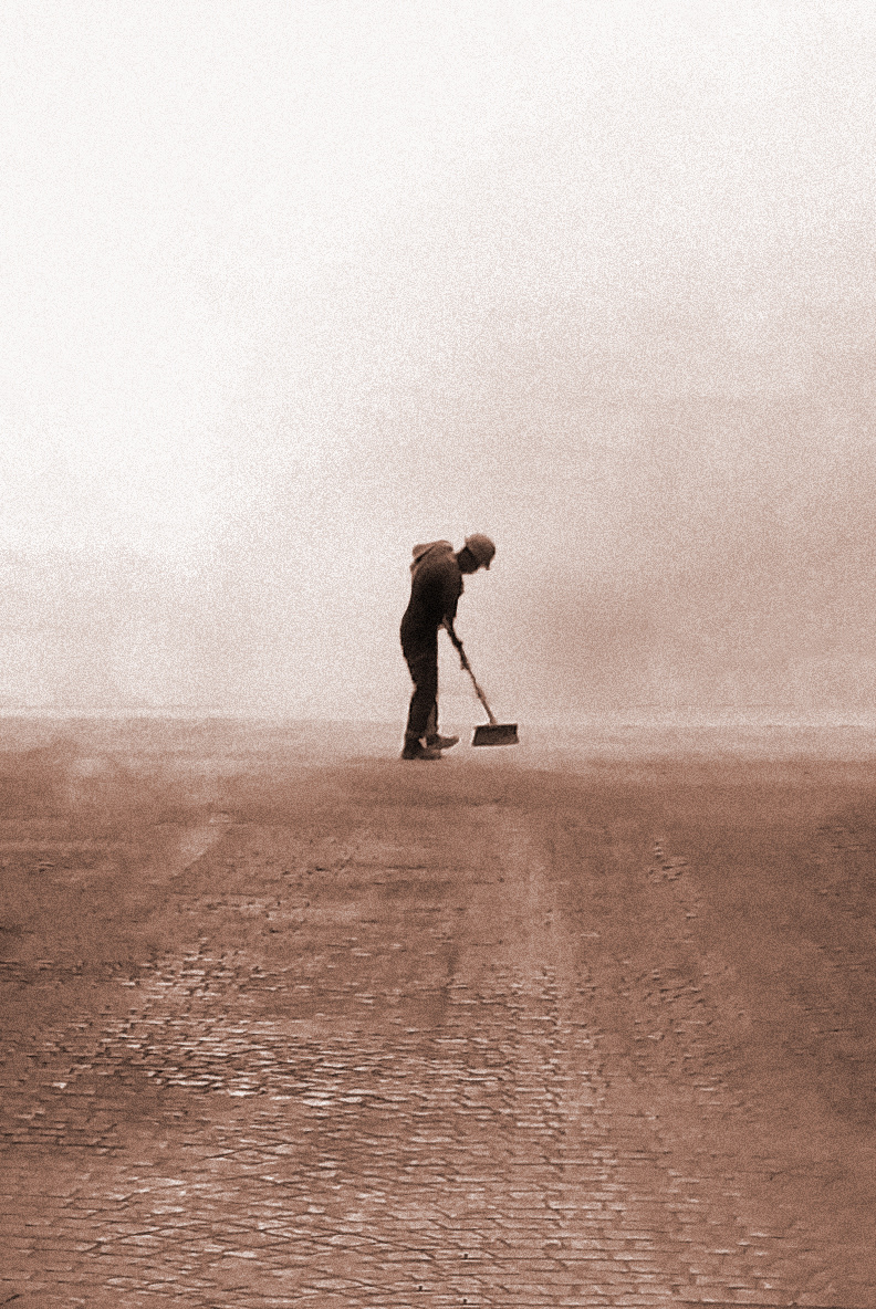 Artwork by Julian Konopelski. Sometimes the most powerful photos are just quick snaps of the most basic reality. This photo, from "Space travellers" collection, representing a street sweeper, or maybe it's just a construction worker sweeping, was taken in Buenos Aires, Argentina, during my trip in January 2019. A very simple, yet powerful and symbolic capture.