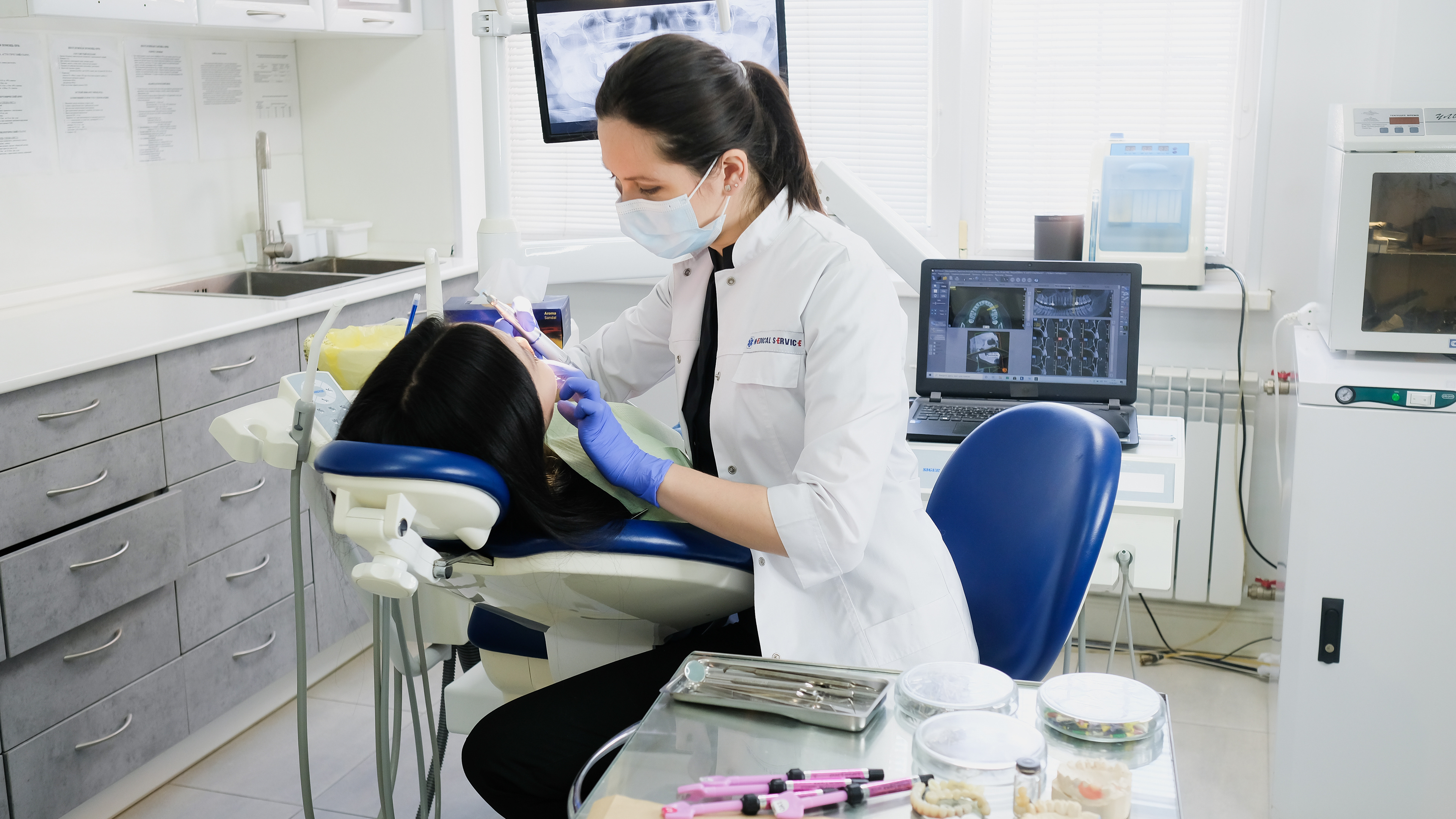 The image captures a professional dentist conducting a comprehensive oral examination to ensure optimal dental health. Visible are modern dental tools and equipment, emphasizing the clinic's commitment to providing top-quality dental care services in Indore.