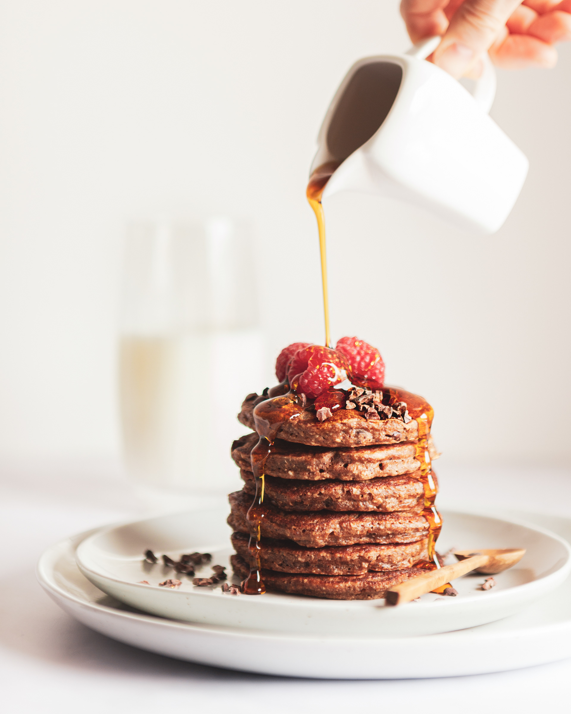 maple syrup poured over pancakes