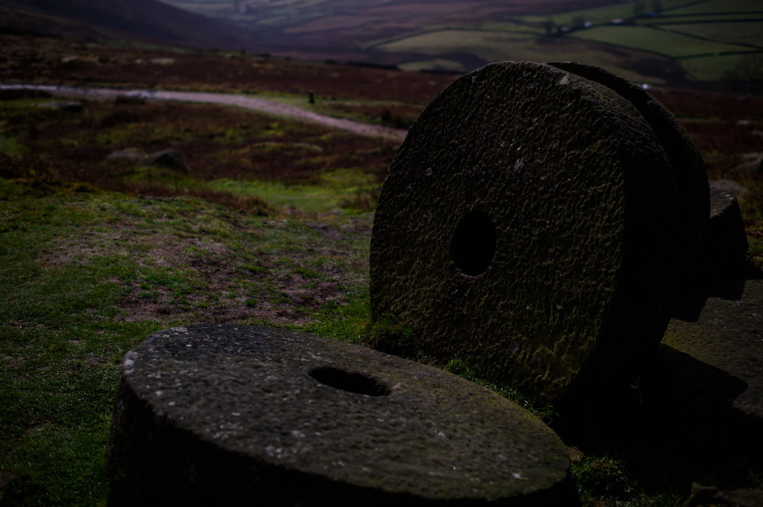 Abandoned carved and chiselled round mill stones, Hook's Car, Stanage Edge, Peak District National Park, Derbyshire, UK