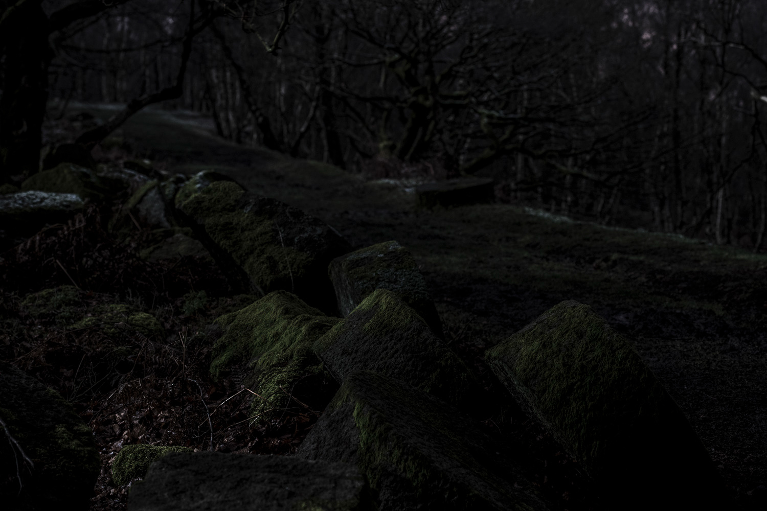 Abandoned carved and chiselled, round mill stones, Lawrencefield quarry (near Hathersage), Peak District National Park, Derbyshire, UK