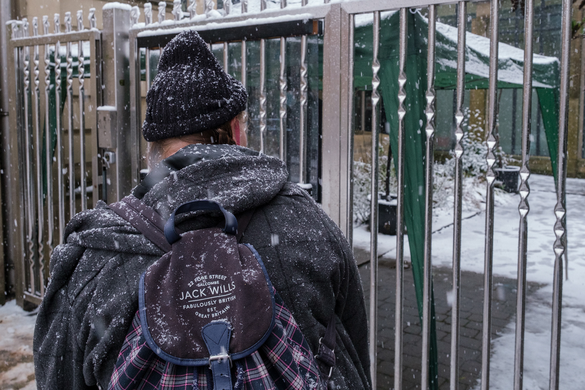 Lockdown3- A homeless person waiting in the snow to be seen outside the Cathedral Archer Project, Sheffield