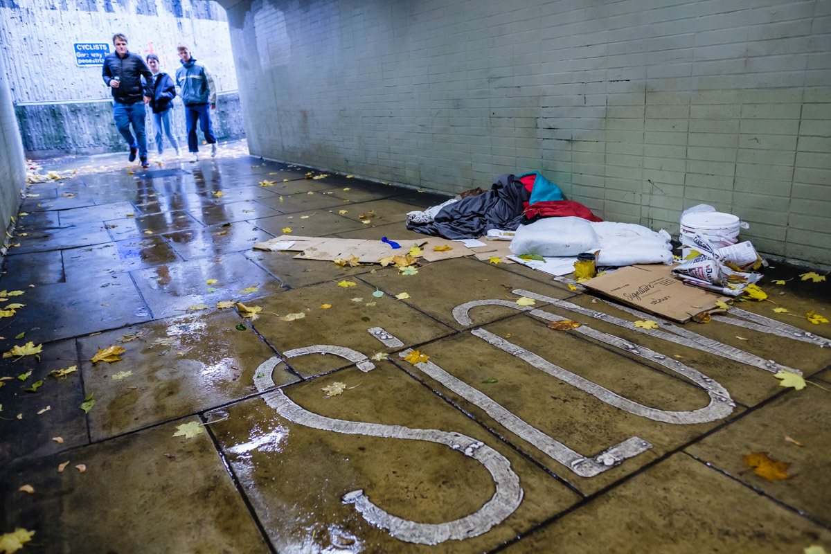 A sleeping bag in a subway used by pedestrians, Sheffield city centre, used by a person sleeping rough.