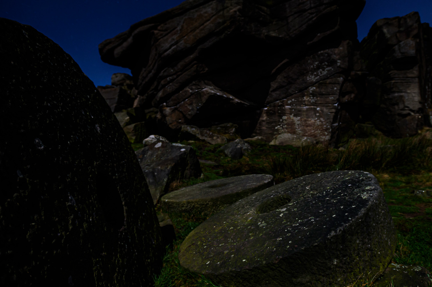Abandoned carved and chiselled round mill stones, Hook's Car, Stanage Edge, Peak District National Park, Derbyshire, UK