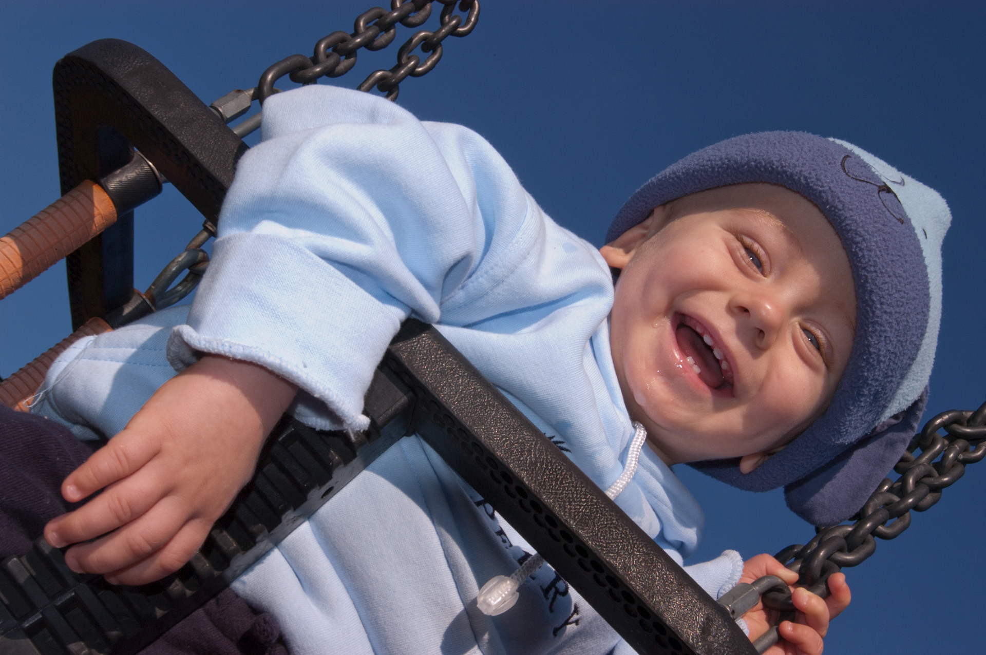 A toddler on a swing
