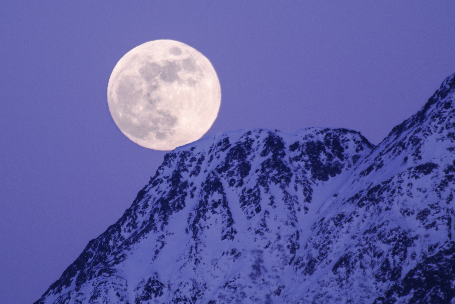 Moon over mountain at sunset, Mat-su Valley, Alaska