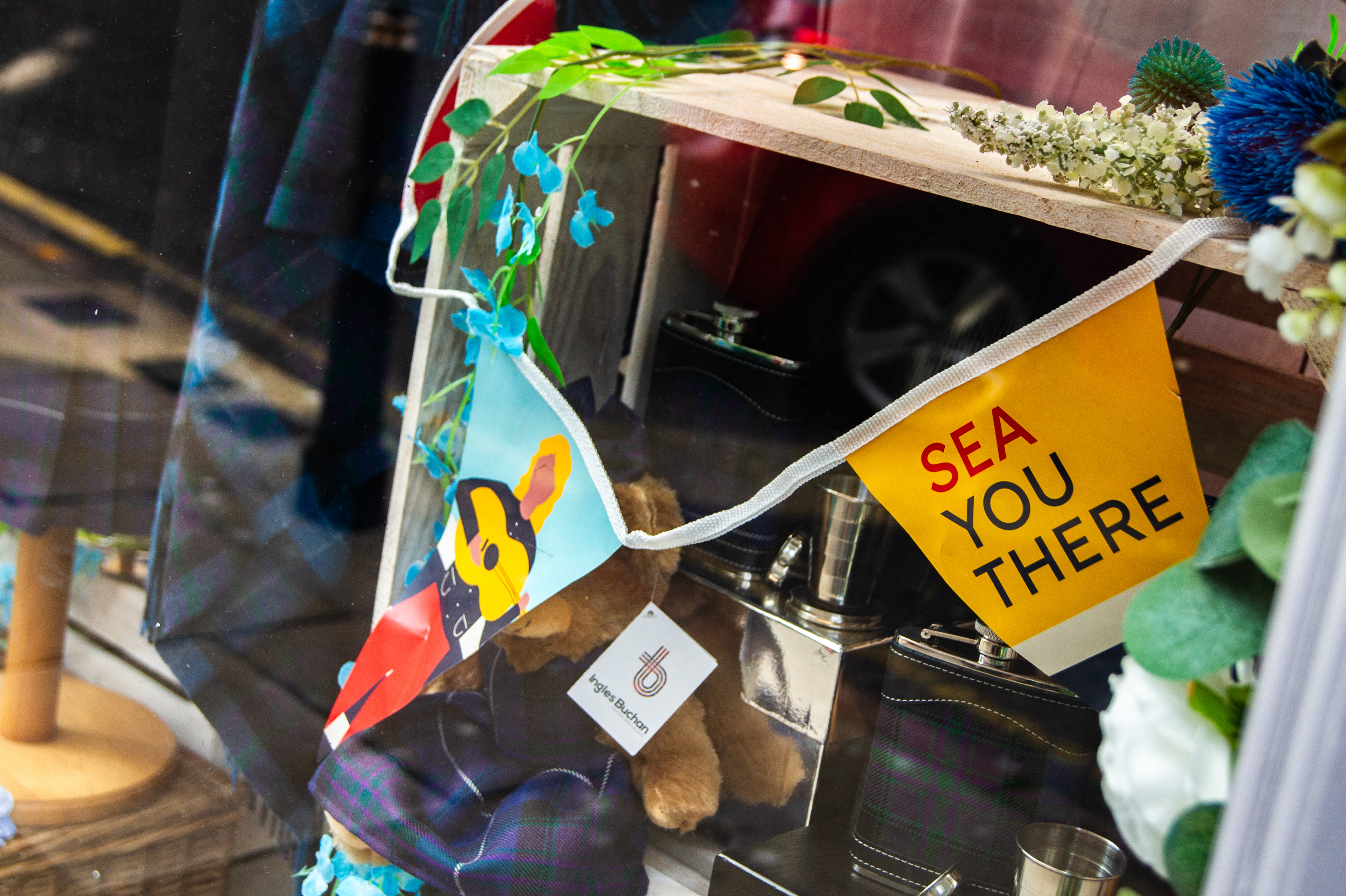 “Close-up views of Tall Ships Race Aberdeen 2025 event design, including city dressing, wayfinding signage, and custom-painted installations
