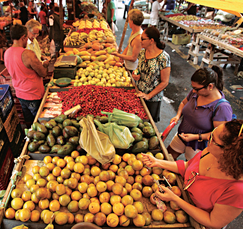 Colourful street market stall in Brazil, reference for Feijoada Art & Design palettes, textures and typographic signage