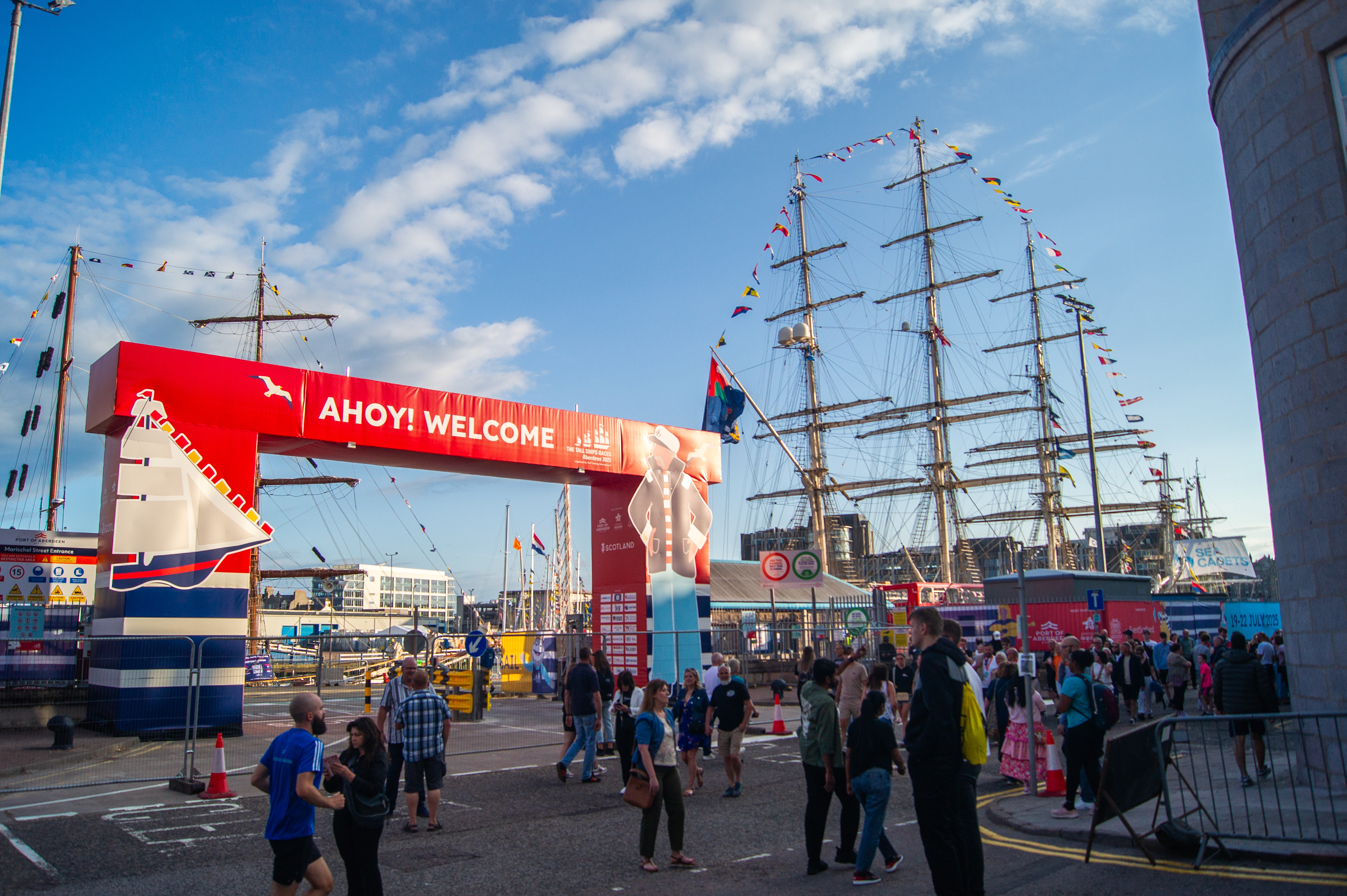 Bespoke event branding projects for Tall Ships Aberdeen 2025 including painted sheds, branded maritime buoys, and entrance gantry installations