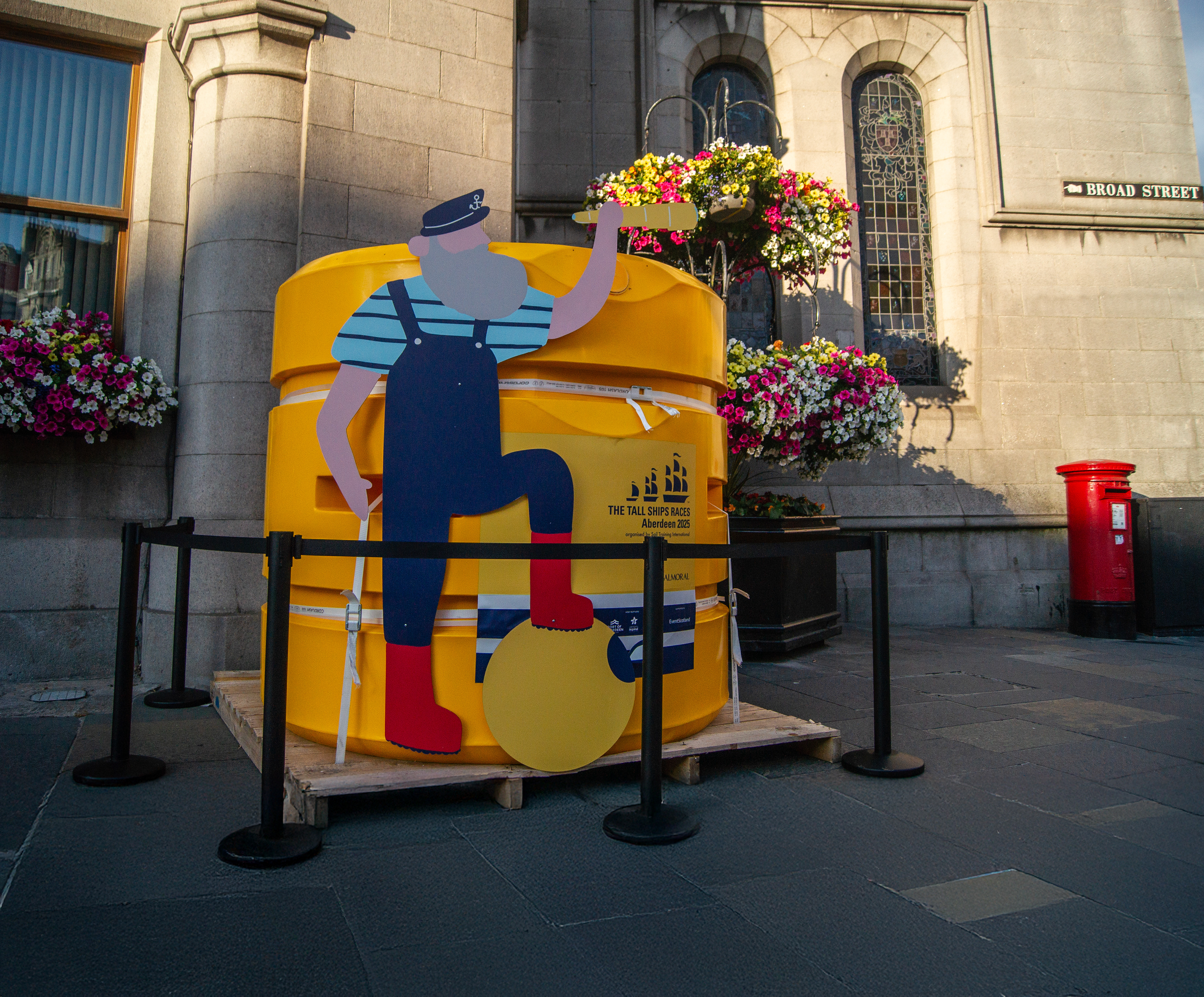 Bespoke event branding projects for Tall Ships Aberdeen 2025 including painted sheds, branded maritime buoys, and entrance gantry installations