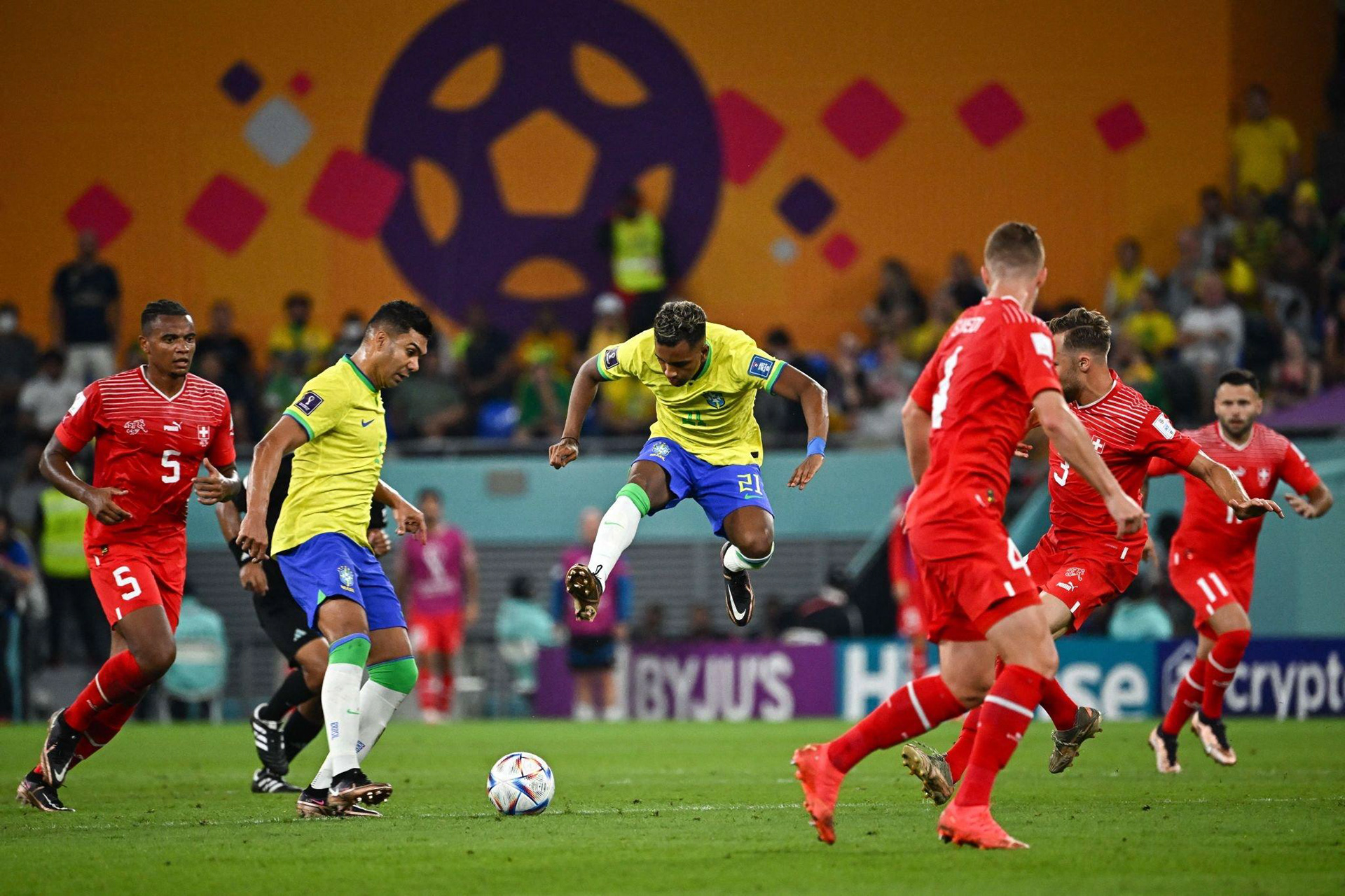 Brand application at Stadium 974, using modular graphics and a vibrant signature colour to reflect the stadium’s innovative temporary architecture.