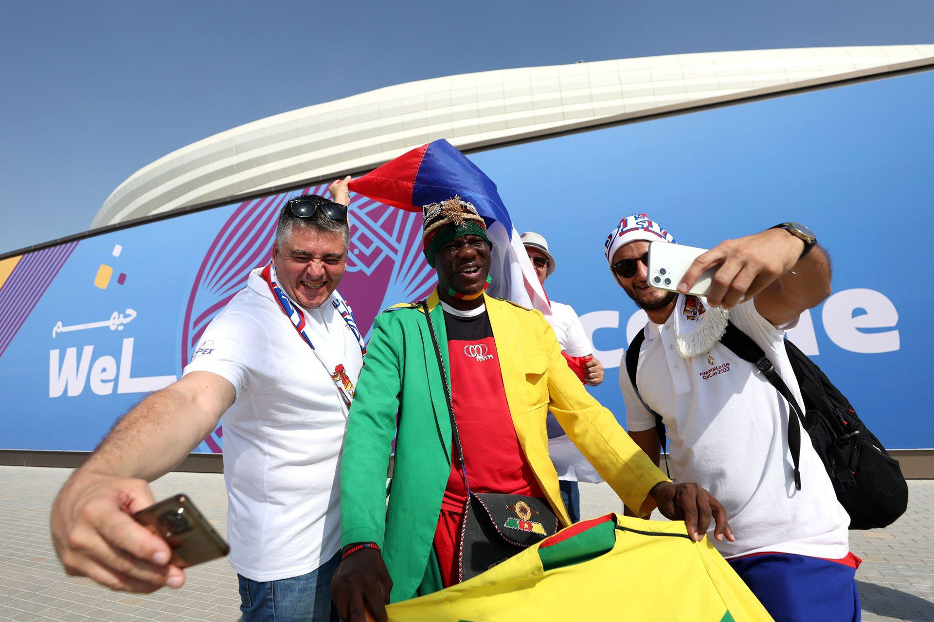 FIFA World Cup Qatar 2022 event branding at Al Janoub Stadium, integrating its flowing graphic elements and unique colour scheme into the visual identity.
