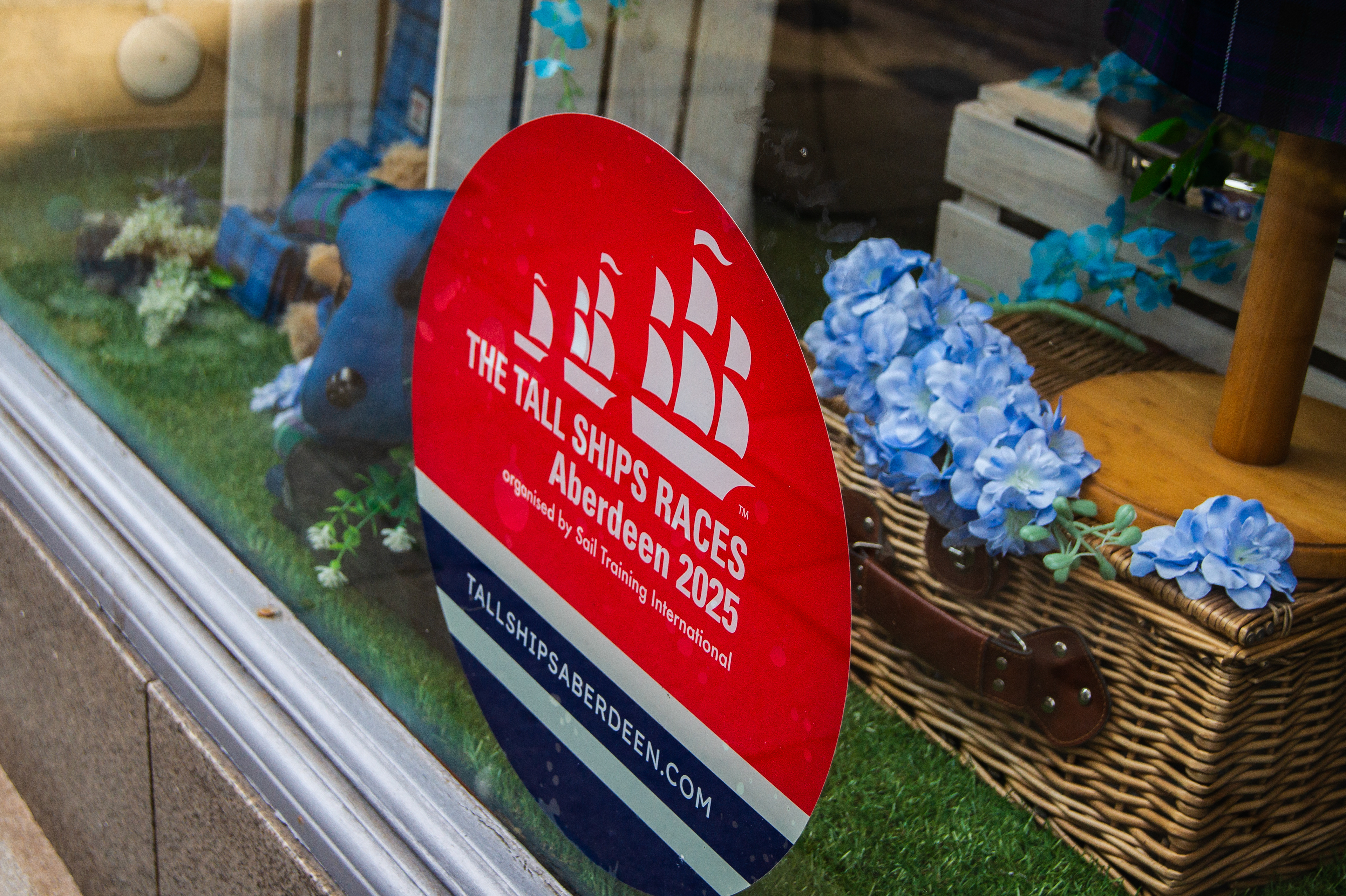 Toolkit of posters, bunting, window stickers, and gifts designed for local businesses to support community engagement in Tall Ships Aberdeen 2025