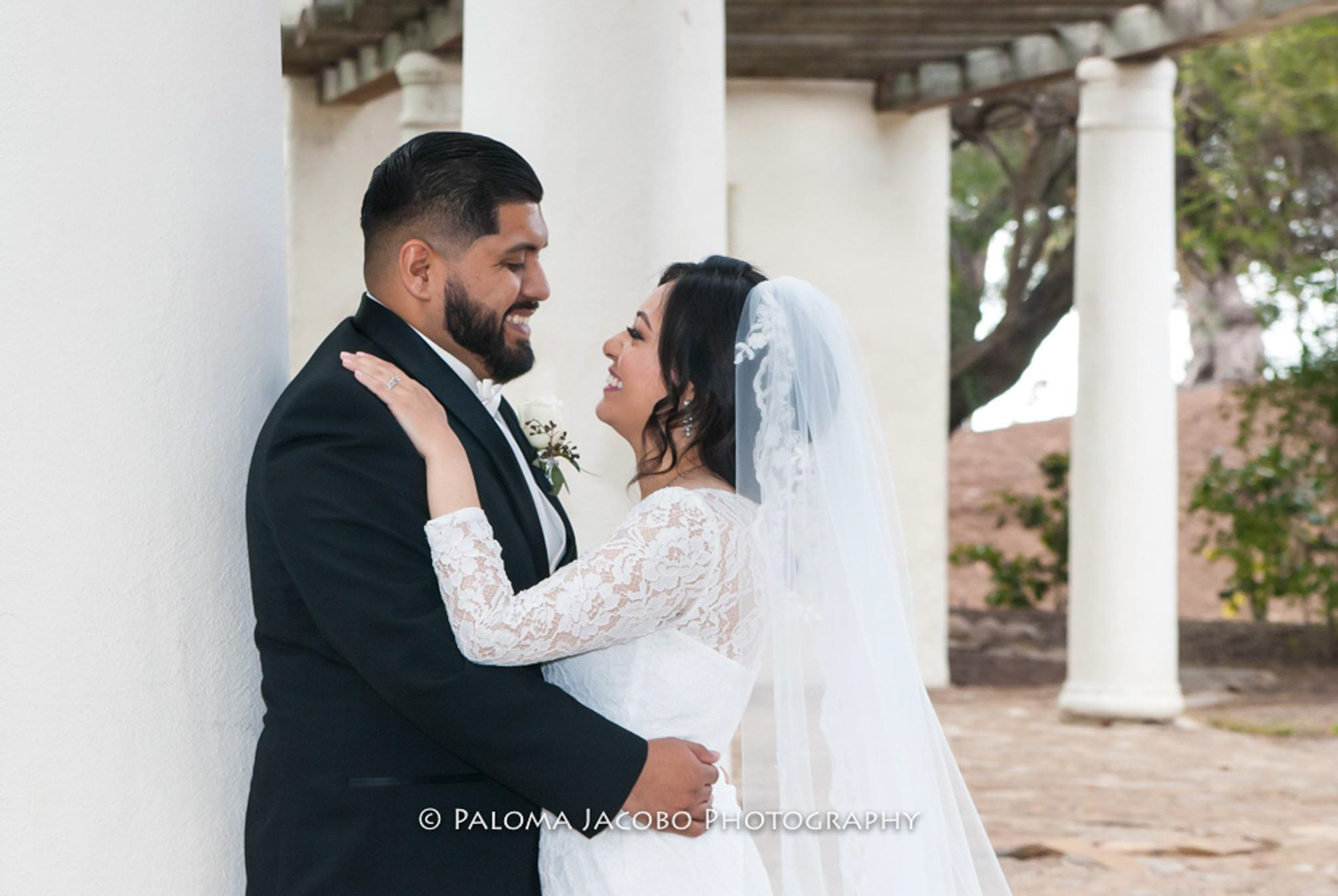 Happy couple at a Wedding photo shoot at Presidio Park in San Diego, CA by Paloma Jacobo Photography
