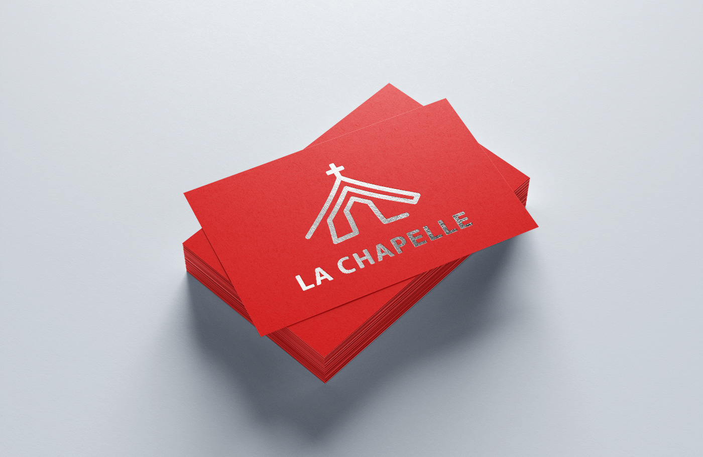 Business card with white logo on red background.