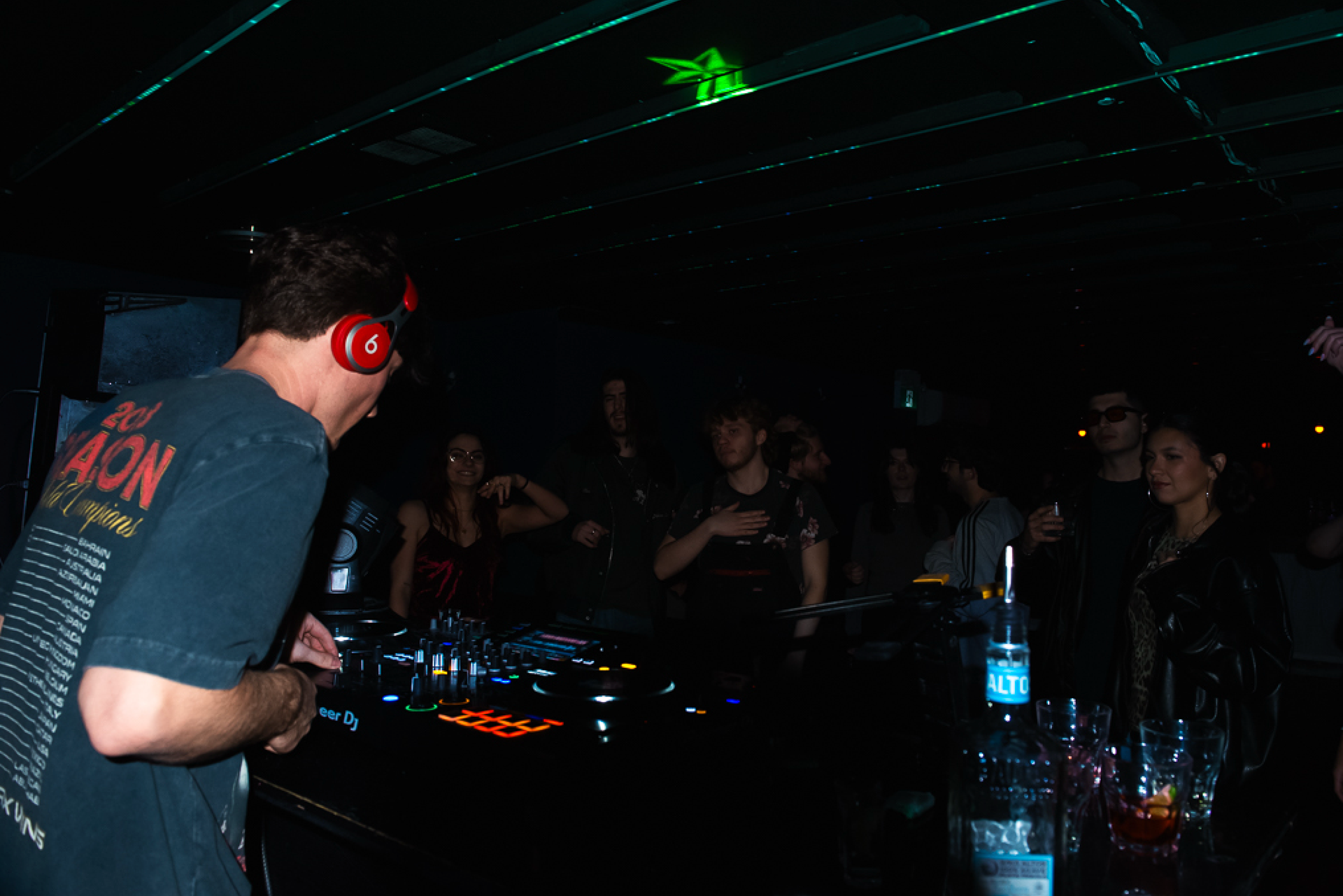 Caption: Toronto DJ Gabe performs for a crowd standing near the stage at Bar Serene in Toronto on Sunday, Feb. 8, 2026. Friends and fans gathered tightly around the DJ booth to experience the artist's dynamic set. Camera Settings: 1/60, ISO 3200, f/2.8