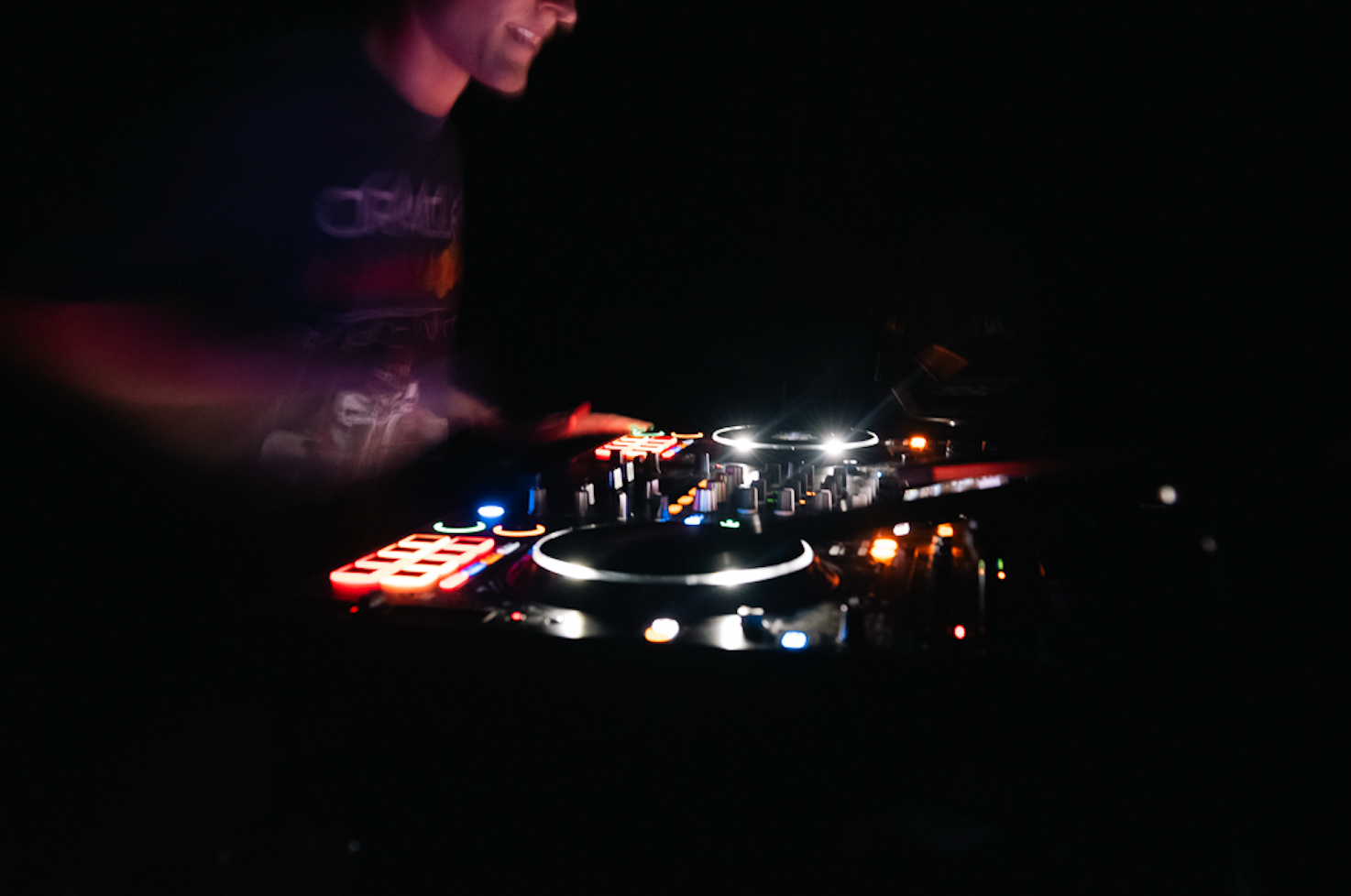 Caption: Toronto DJ Gabe adjusts the audio levels on his mixing board in the dark while performing at Bar Serene in Toronto on Sunday, Feb. 8, 2026. The crowd responded enthusiastically to his heavy bass drops and seamless track transitions throughout the evening. Camera Settings: 1/8, ISO 1100, f/2.8