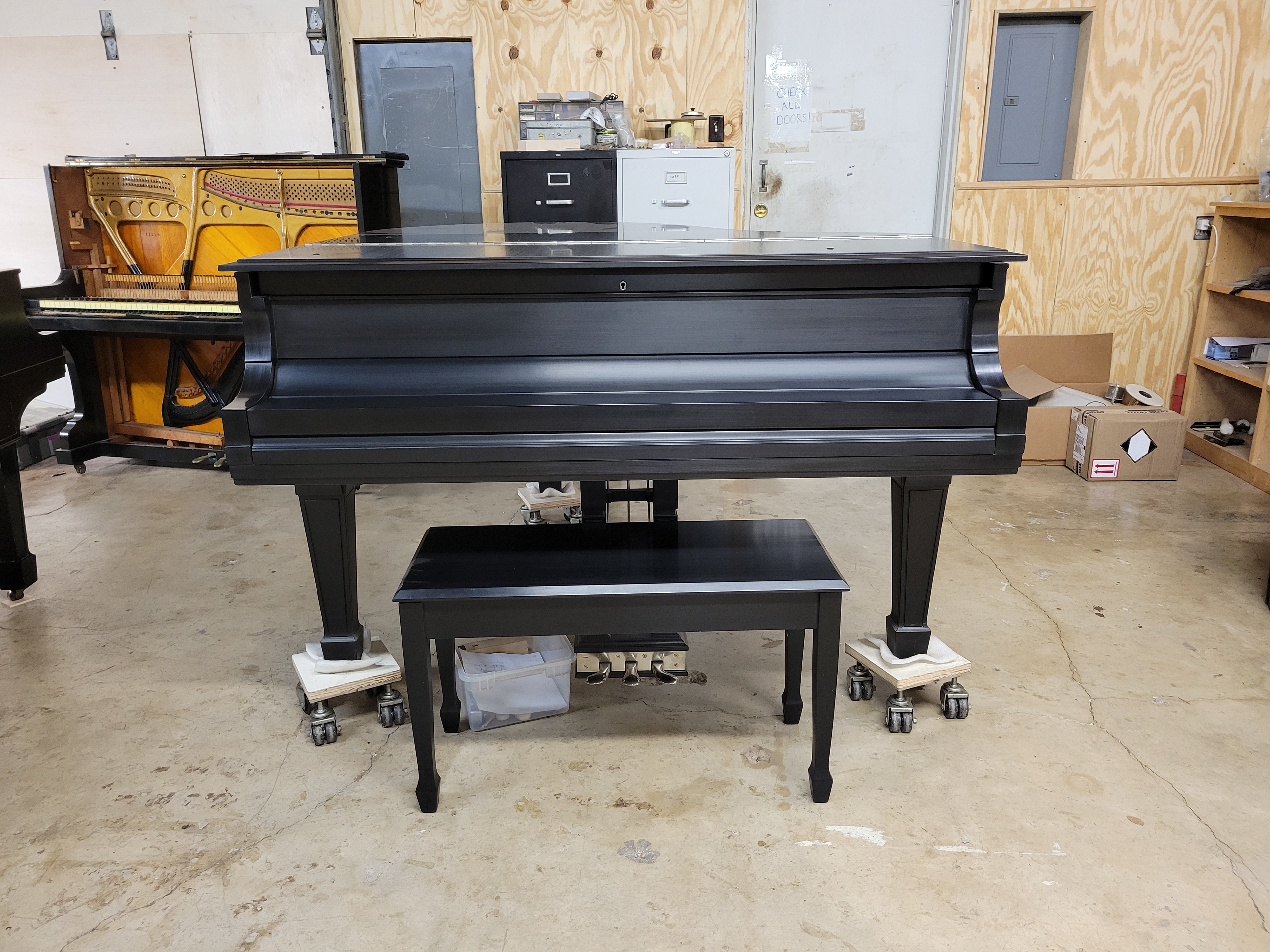 Hand rubbed satin piano finish