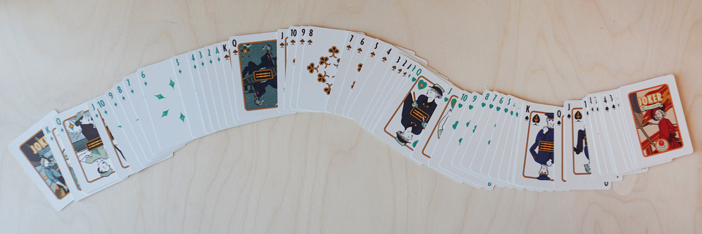 Full ribbon spread of the Divinissimi Assi playing cards — complete deck designed by CalamoVe, printed by WJPC.