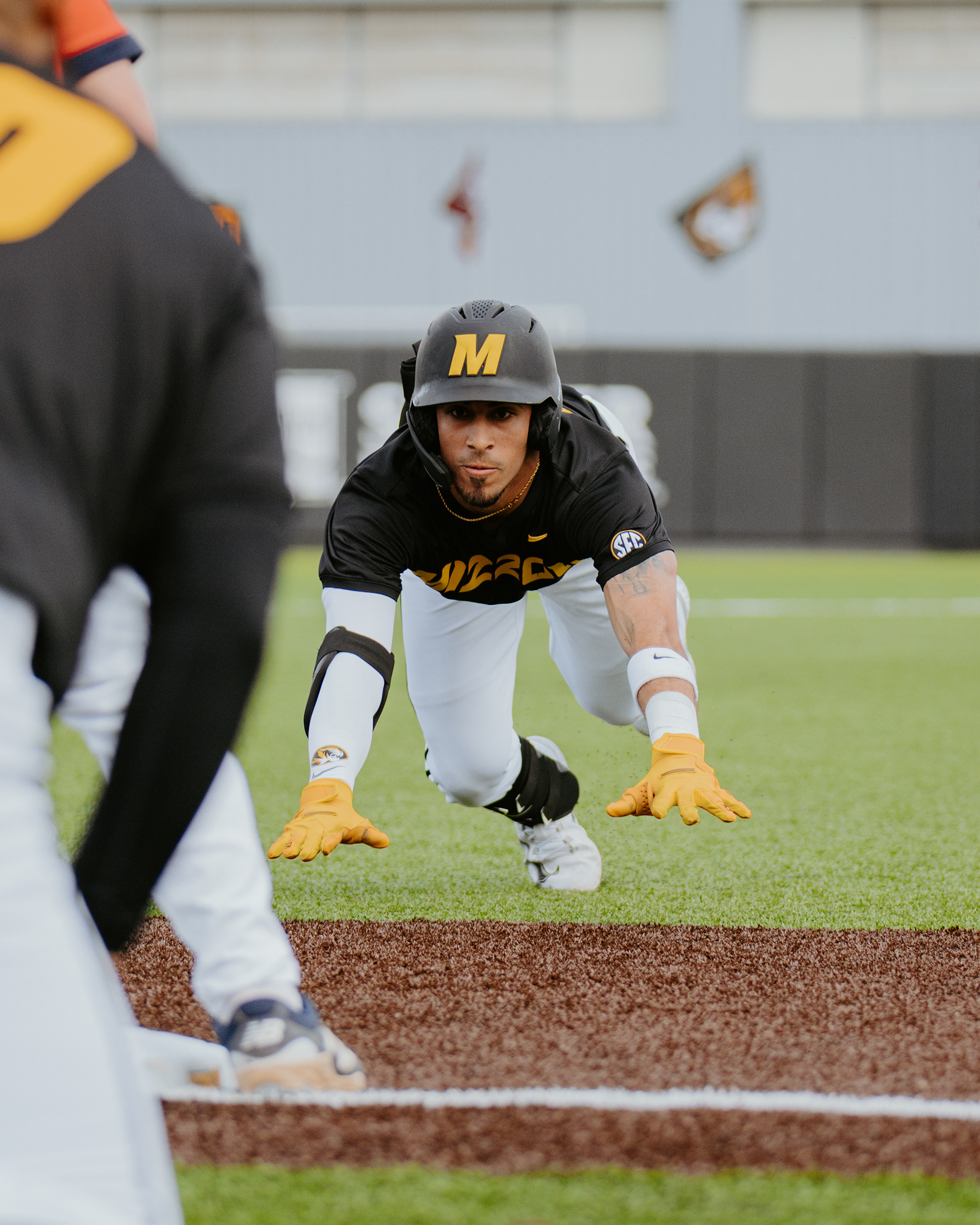 Eric Maisonet dives into third base at Taylor Stadium on March 10, 2026, in Columbia, Missouri.