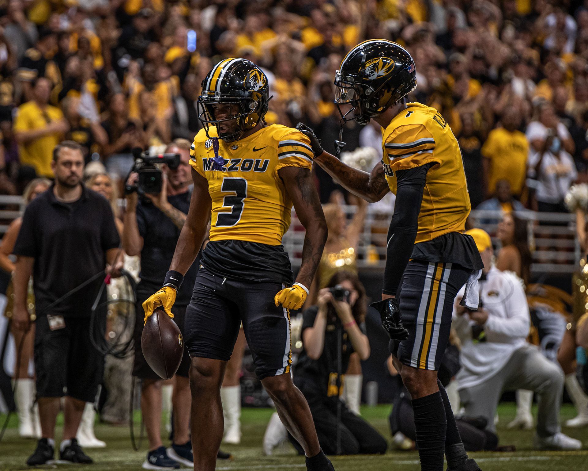 From left, Mizzou wide receiver Luther Burden (3) celebrates with wide receiver Theo Wease Jr. (1) at the Dome at America’s Center on Sept. 23, 2023, in St. Louis, Mo. 