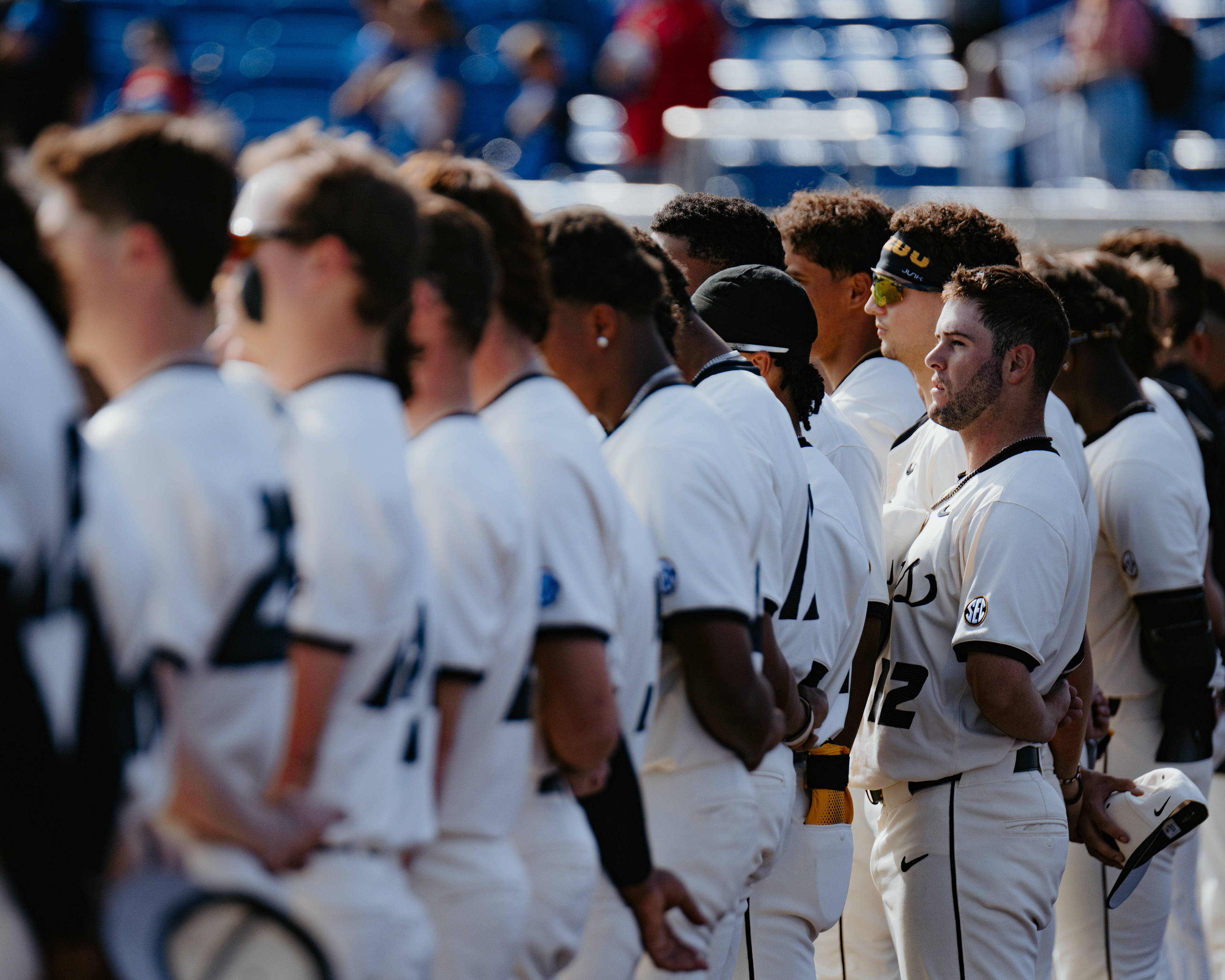 Keegan Knutson stands for the national anthem at Hoglund Ballpark on March 18, 2026 in Lawrence, Kansas.